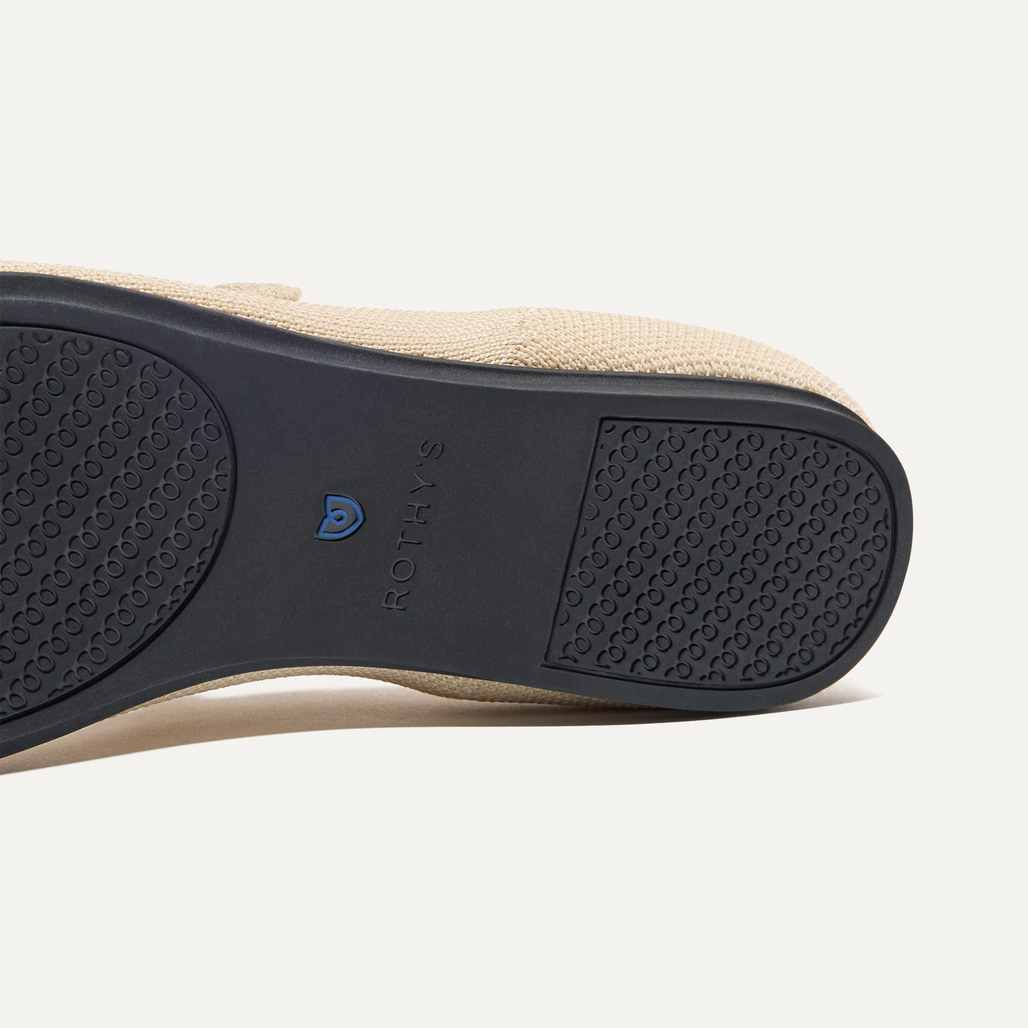 The sole of The Square Mary Jane in Cream Captoe shown in diagonal view.