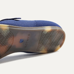 The sole of The Square Mary Jane in Deep Navy shown in diagonal view.