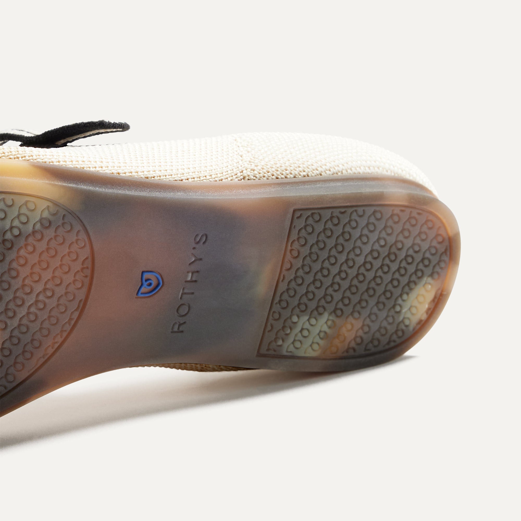 The sole of The Square Mary Jane in Gardenia shown in diagonal view.