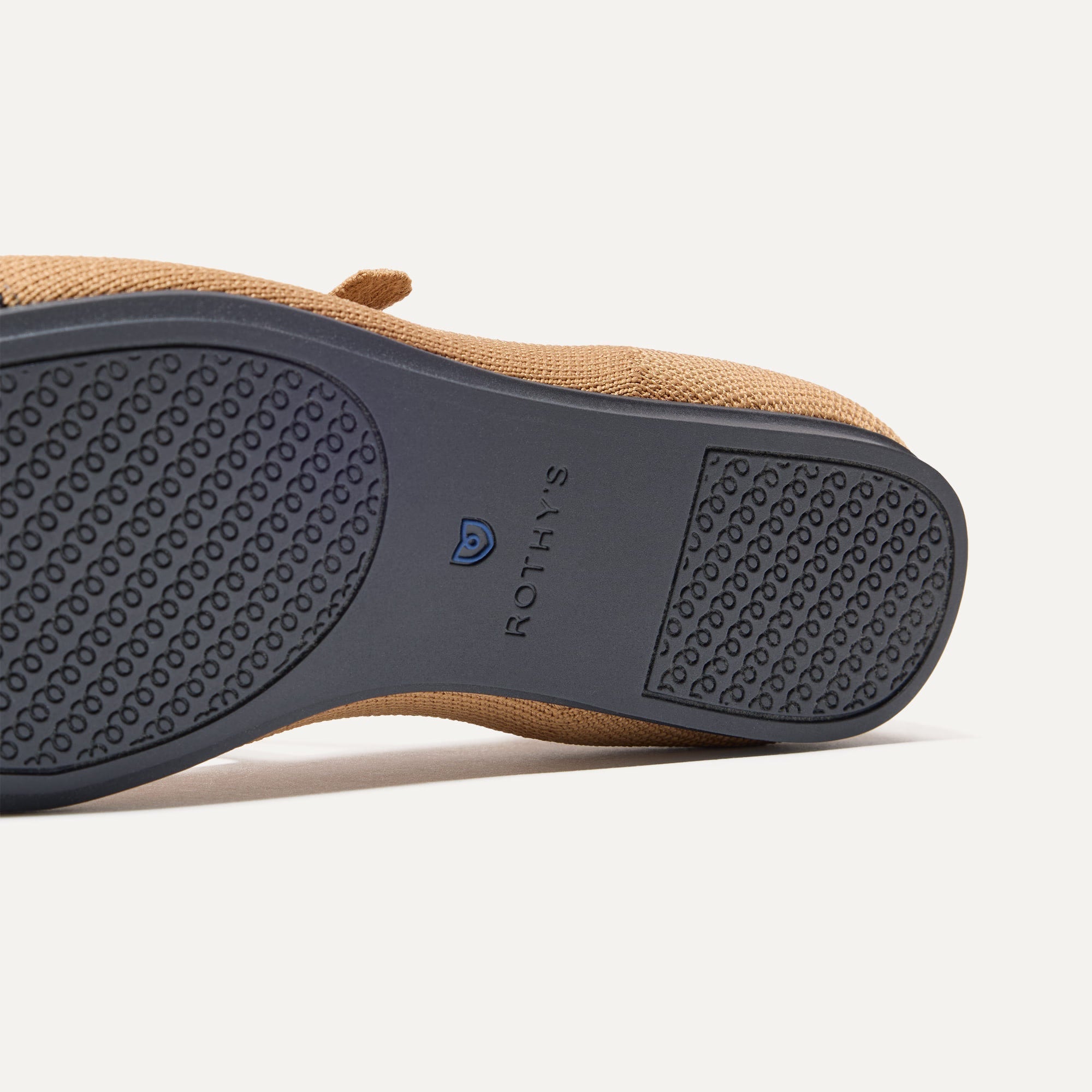 The sole of The Square Mary Jane in Wren Captoe shown in diagonal view.