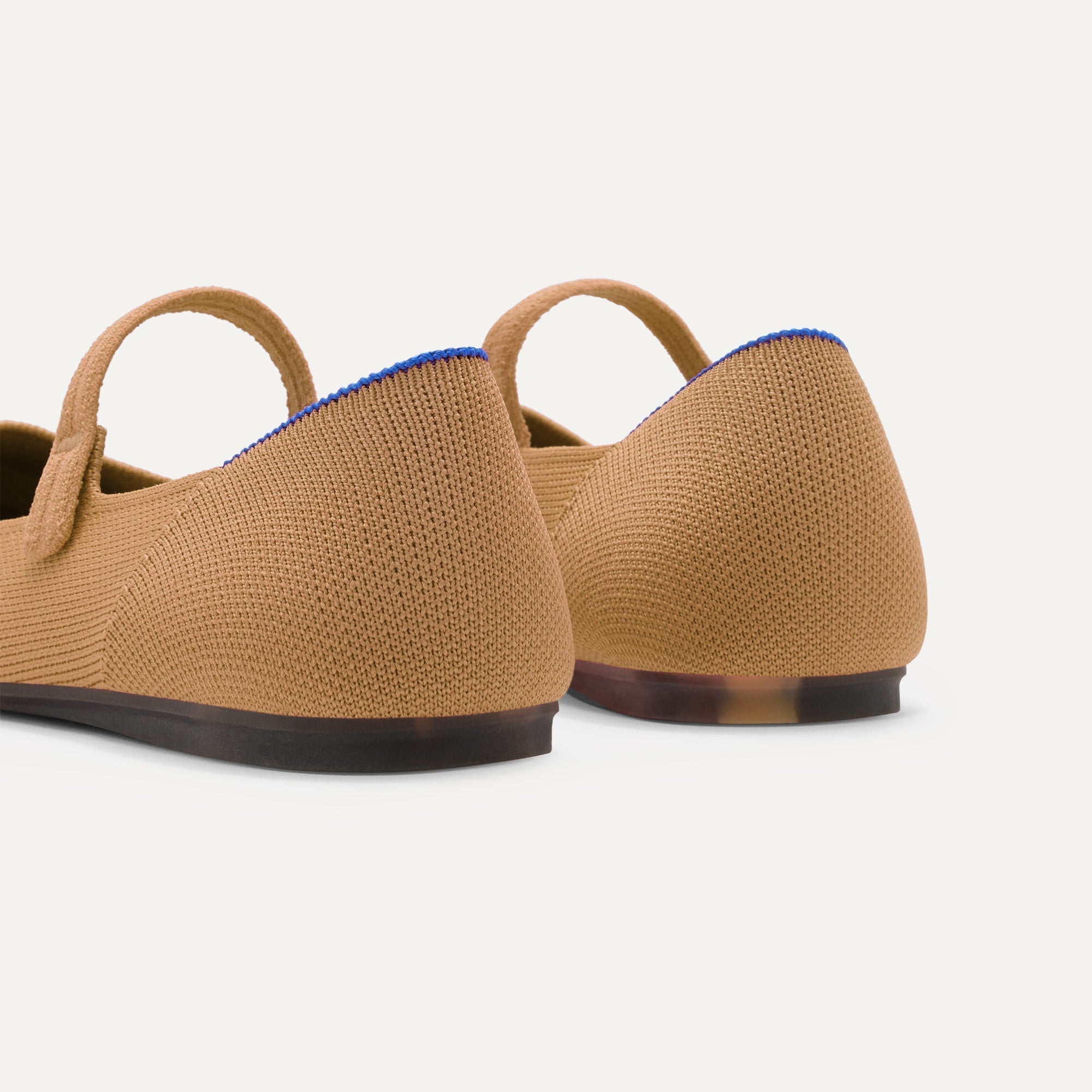 Close up of the heel of The Square Mary Jane in Wren, with Rothy's signature blue halo. 