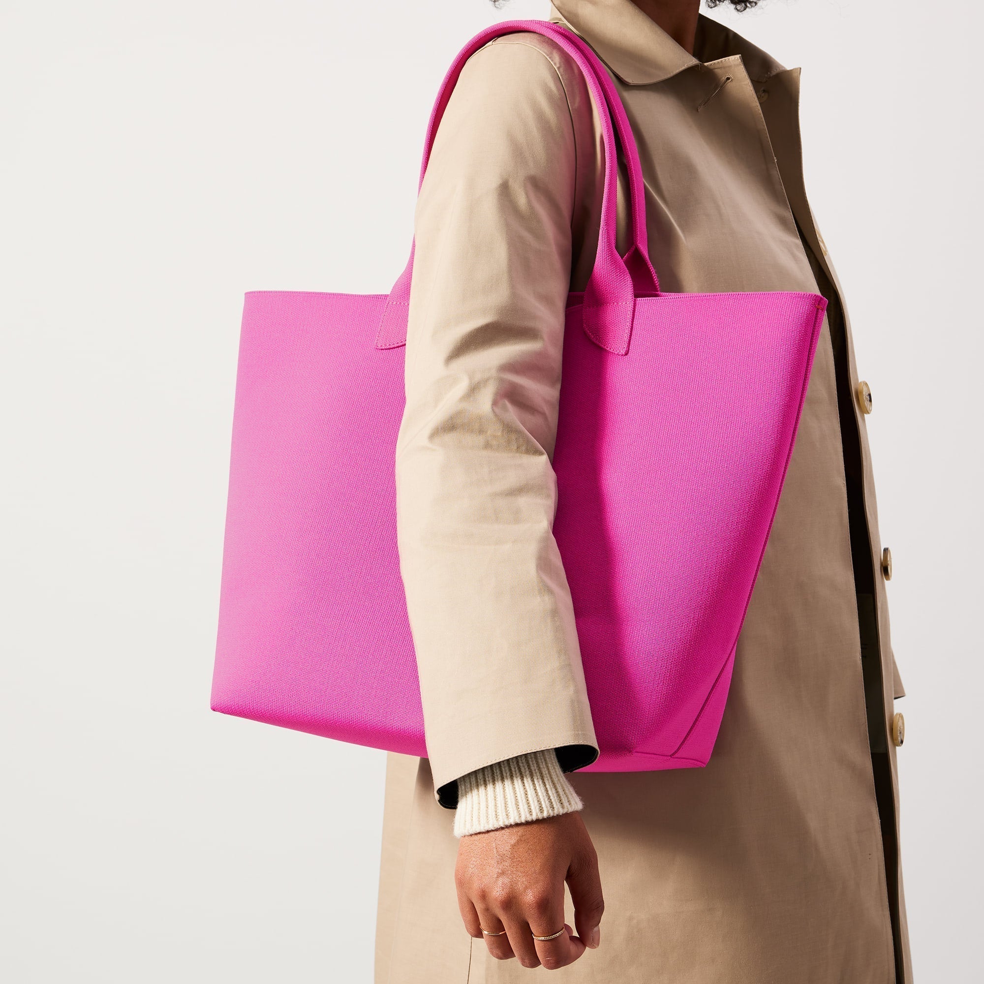hover | Model holding The Lightweight Tote in Dragon Fruit.