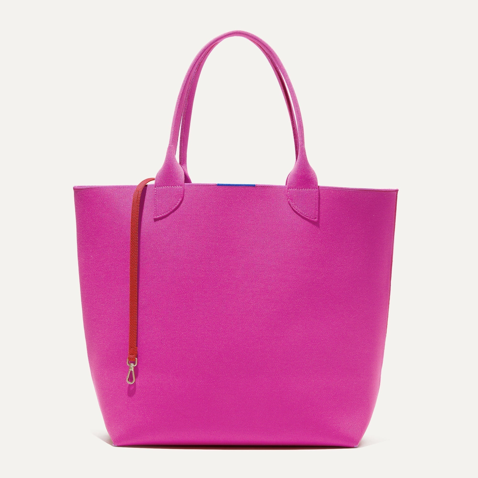 The Lighweight Tote in Dragon Fruit shown with its handy key leash.