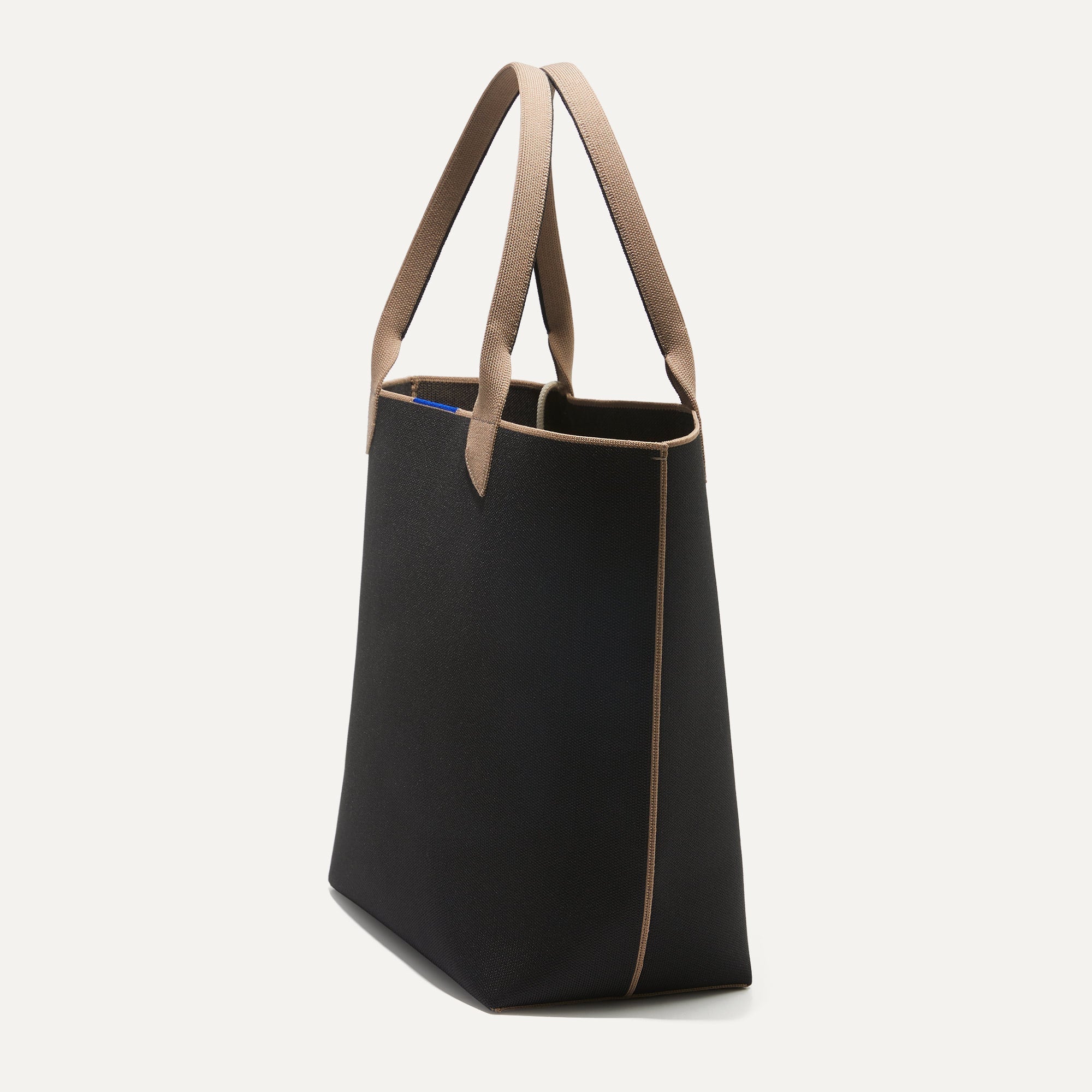 The Lightweight Tote in Black Portobello shown in diagonal view.