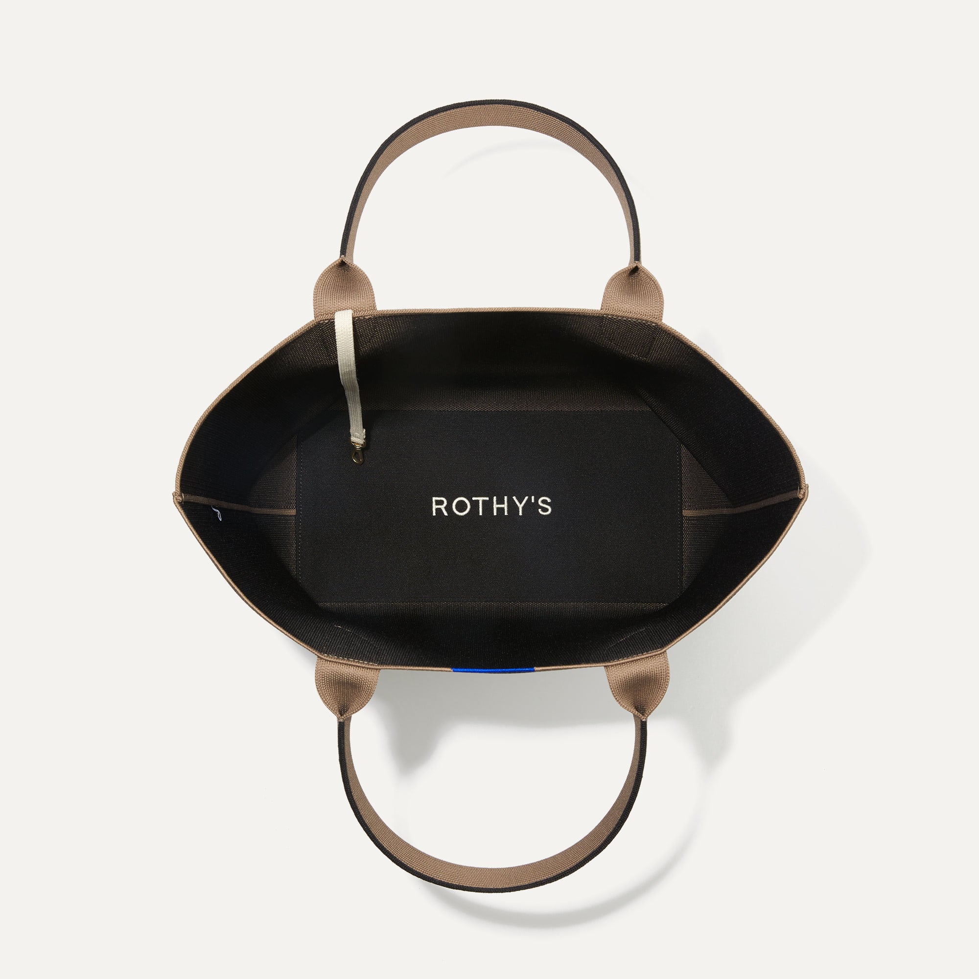 The Lightweight Tote in Black Portobello shown open from the top, with base insert visible. 