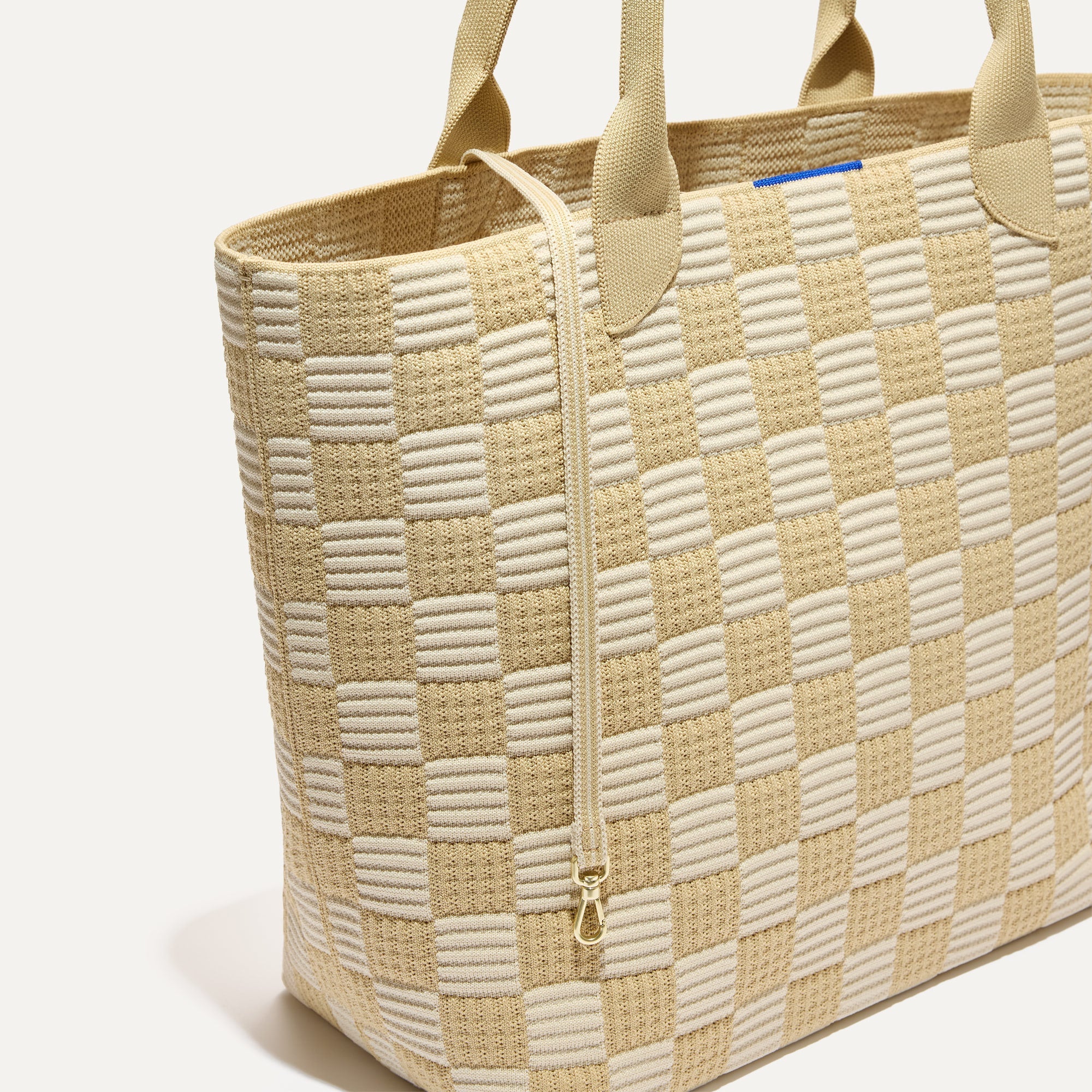 The Lightweight Tote in Checker Sand shown with its handy key leash.