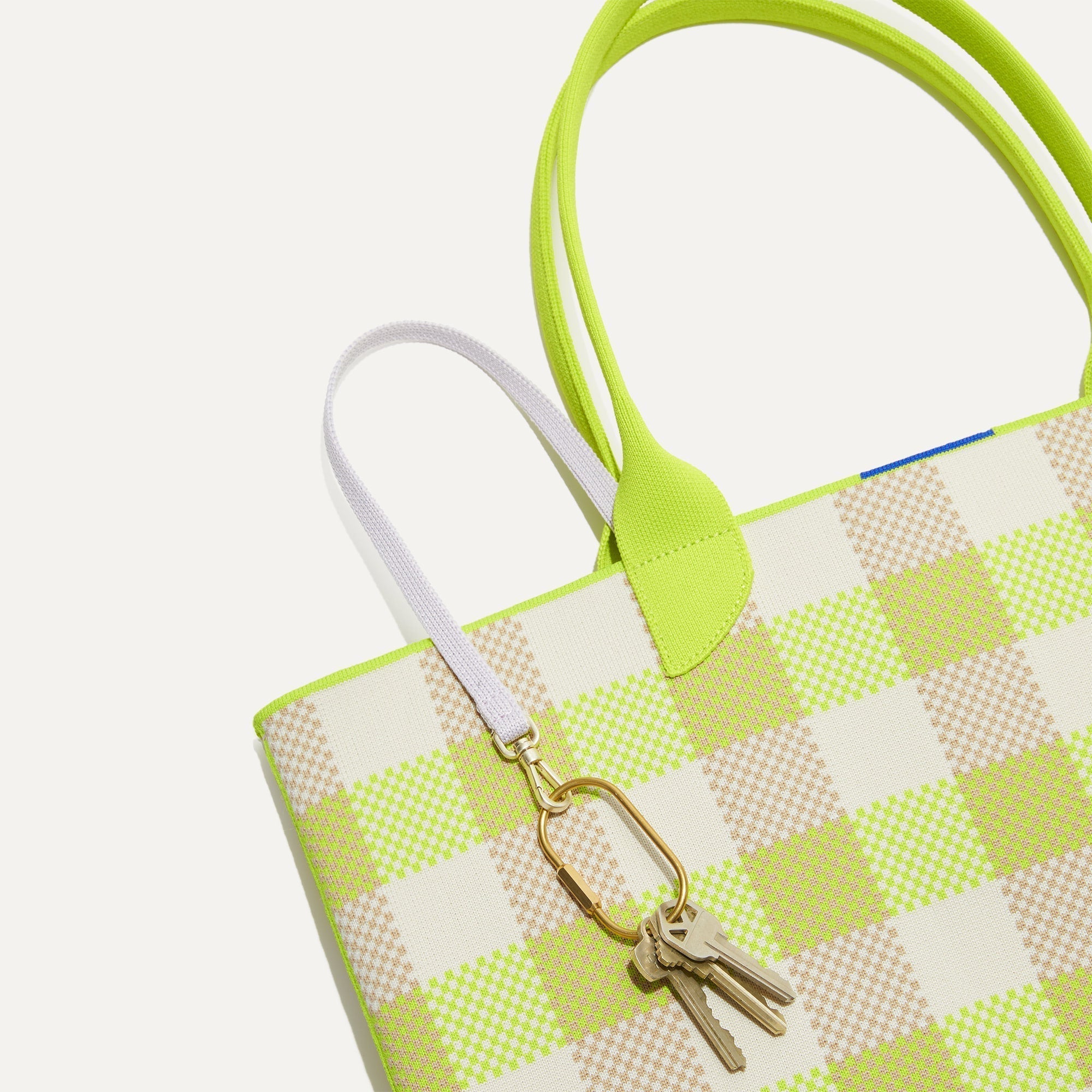 Close up of the handles and key leash detail of The Lightweight Tote in Citrus GIngham.