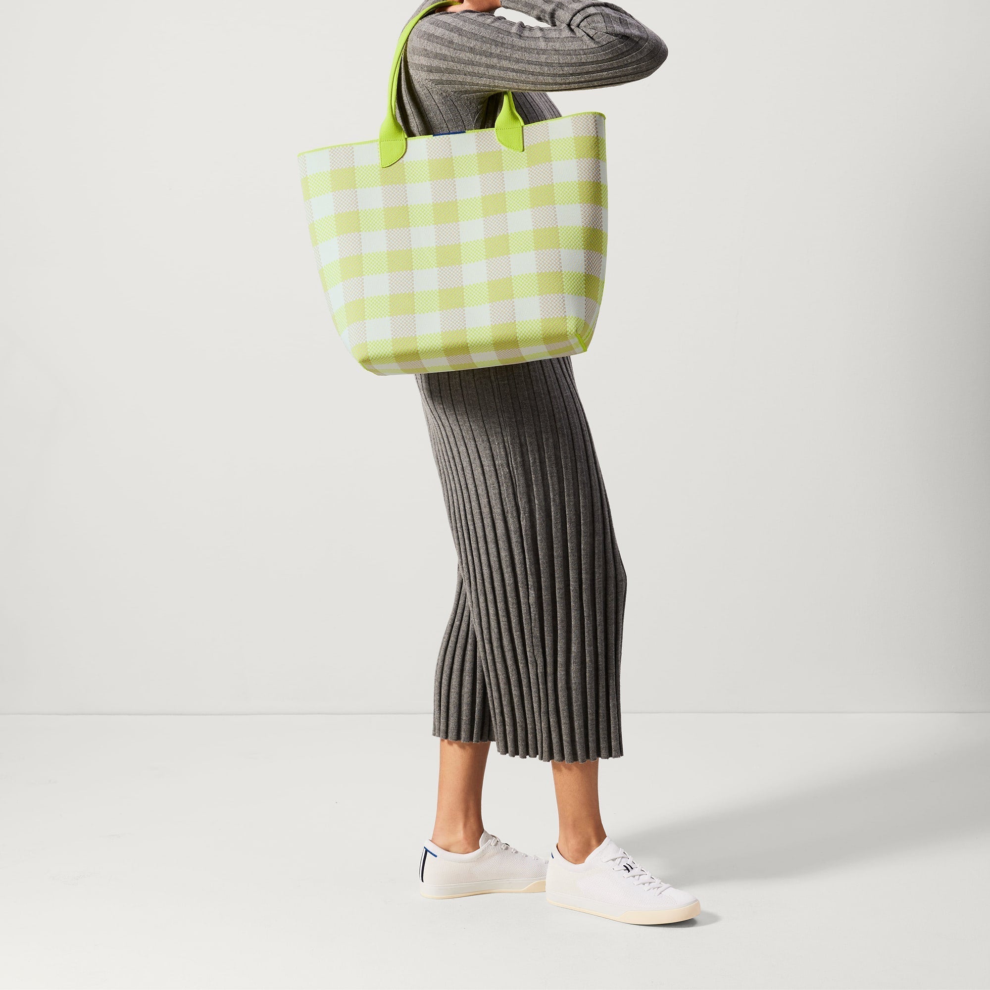 An alternate view of model holding The Lightweight Tote in Citrus Gingham.