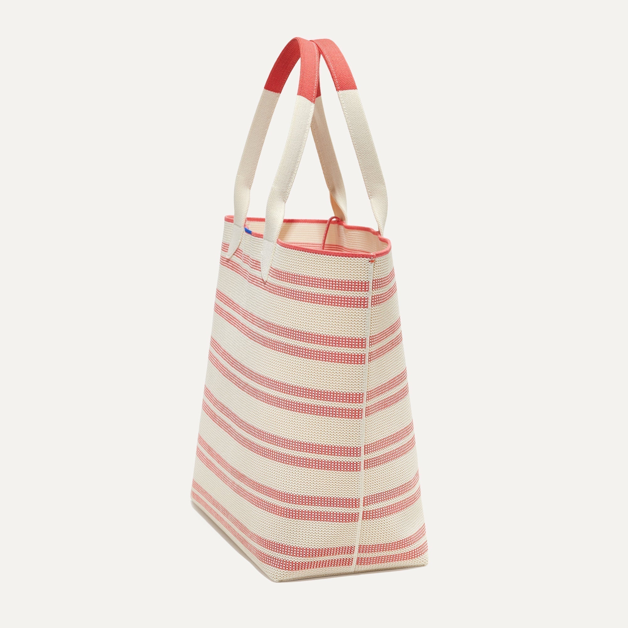 The Lightweight Tote in Coral Stripe shown in diagonal view.