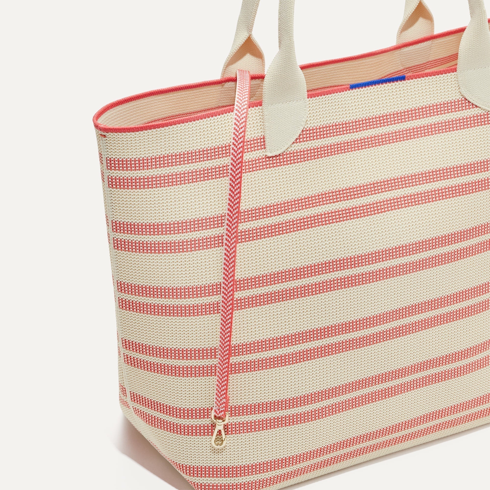 The Lightweight Tote in Coral Stripe shown with its handy key leash.