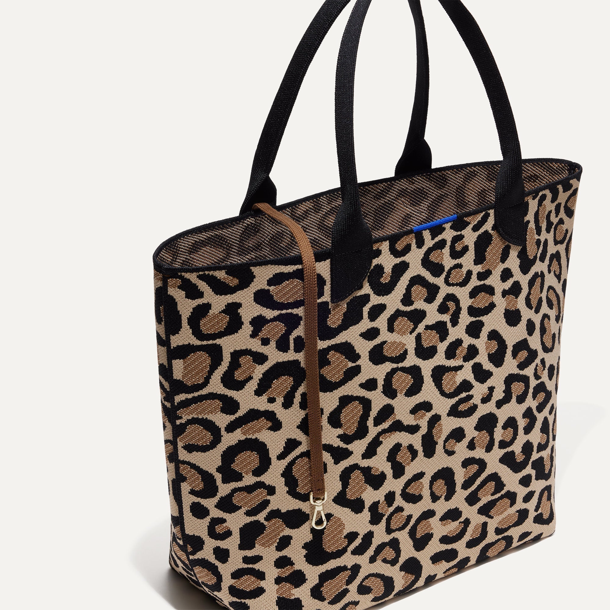 The Lightweight Tote in Desert Cat shown with its handy key leash.