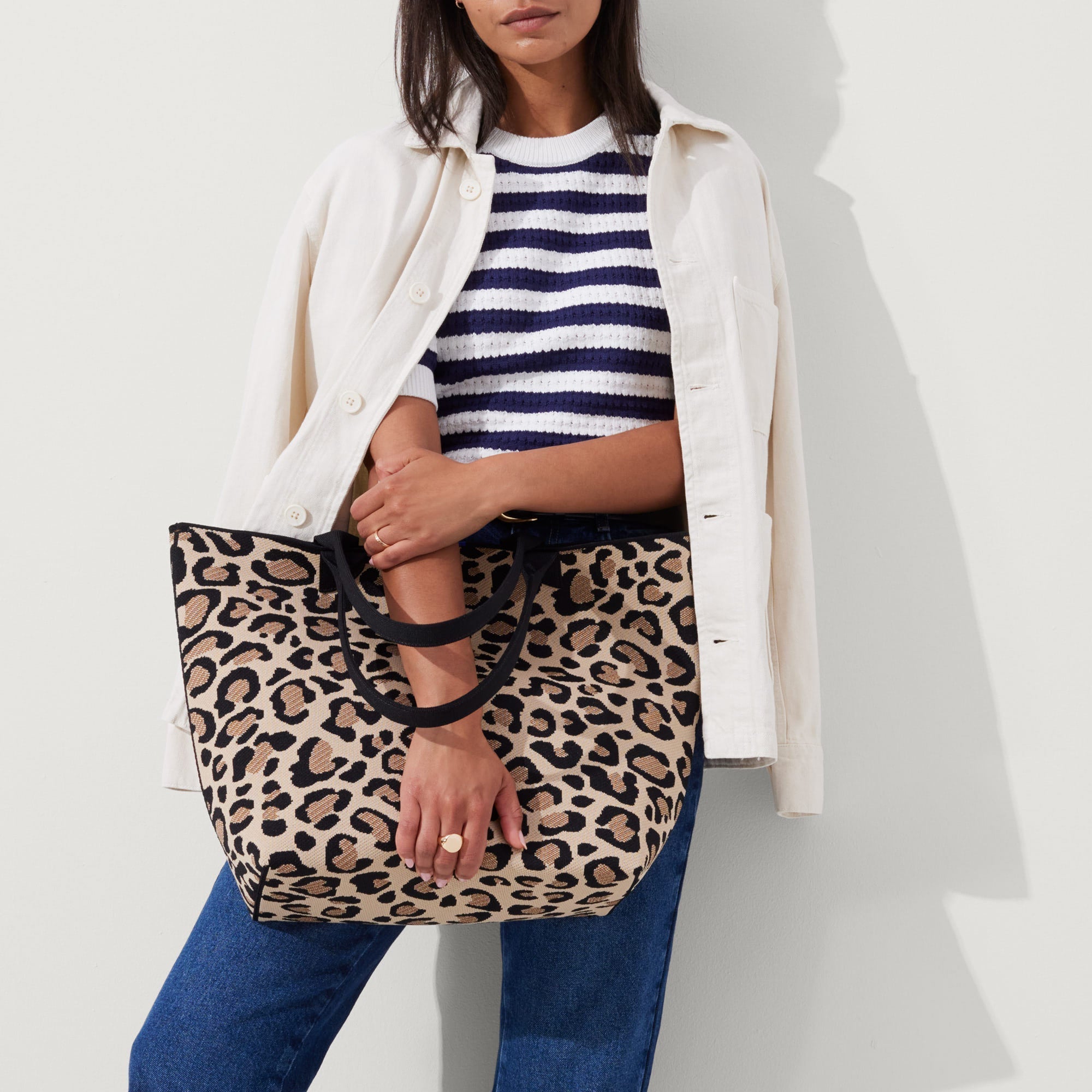 hover | Model holding The Lightweight Tote in Desert Cat.