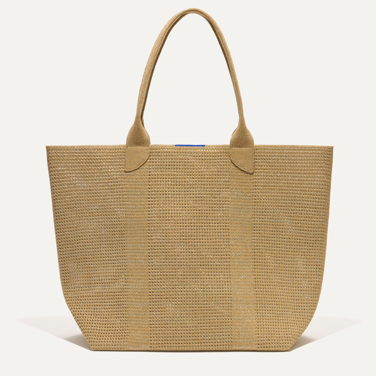 PLP |The Lightweight Tote in Golden Perf shown from the front.