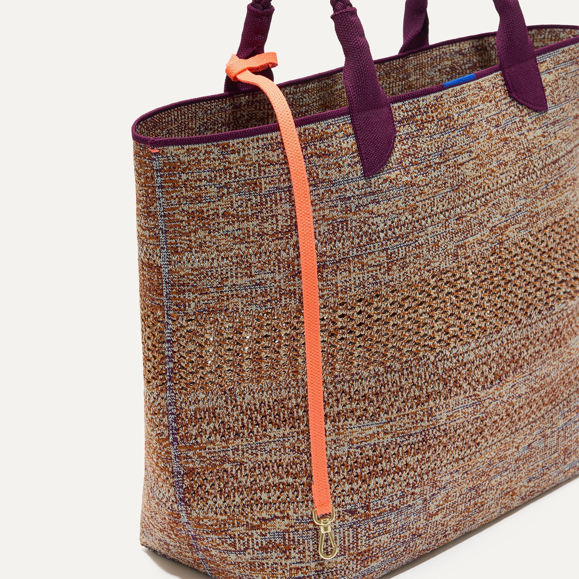 Close up of the handles and key leash detail of The Lightweight Tote in Revive Mélange.