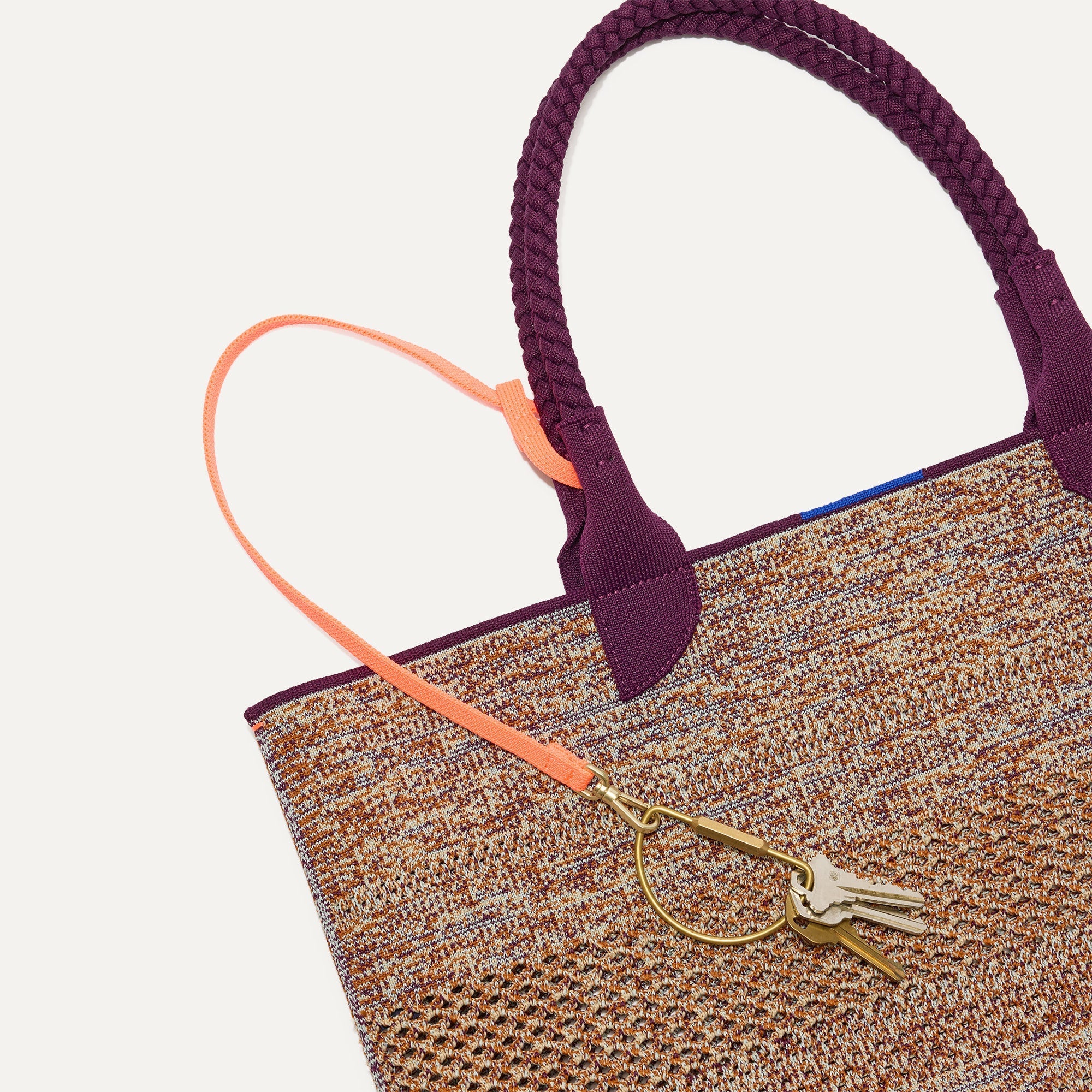 The Lightweight Tote in Revive Mélange shown with its handy key leash.