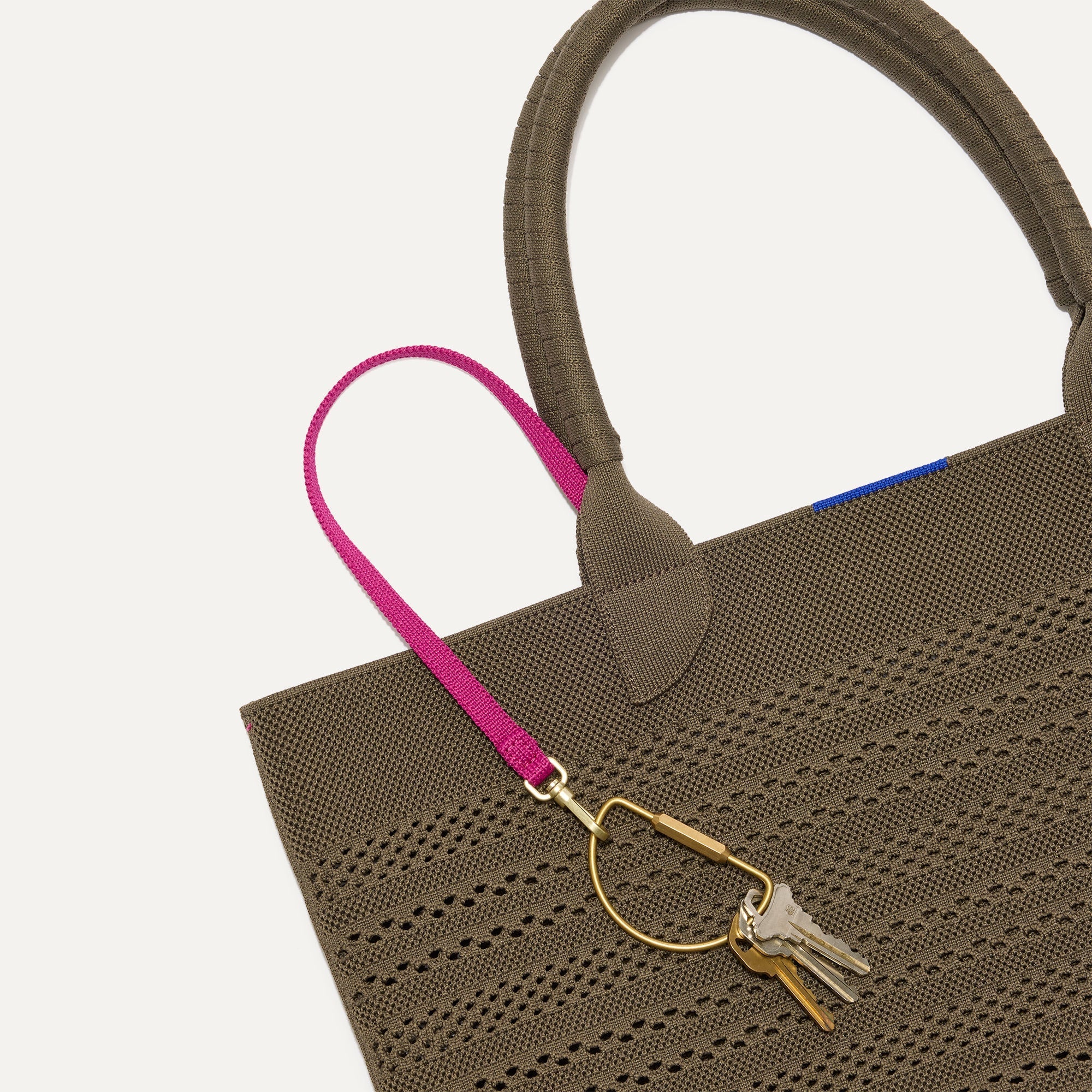 Close up of the handles and key leash detail of The Lightweight Tote in Safari Crochet.