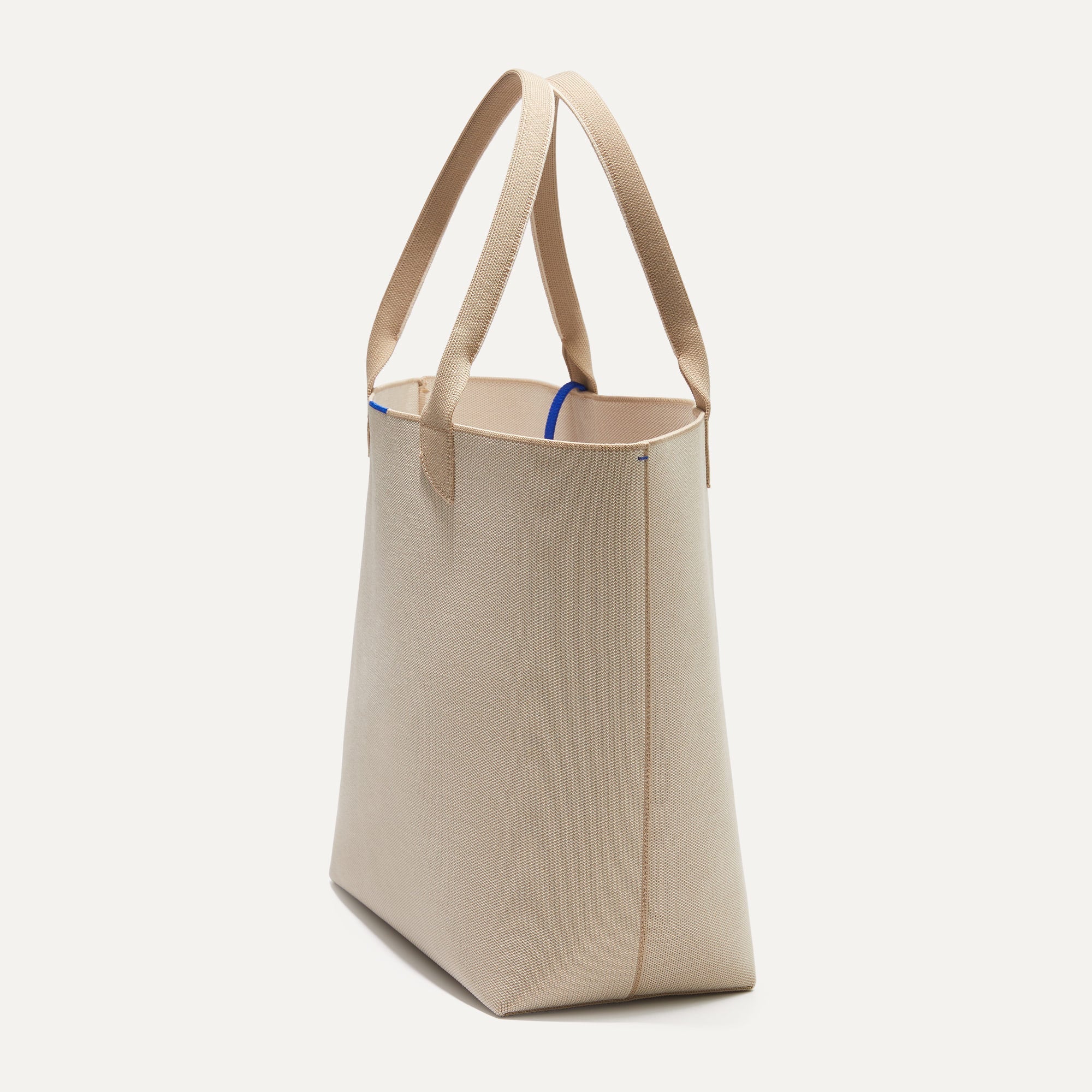 The Lightweight Tote in Soft Sesame shown in diagonal view.