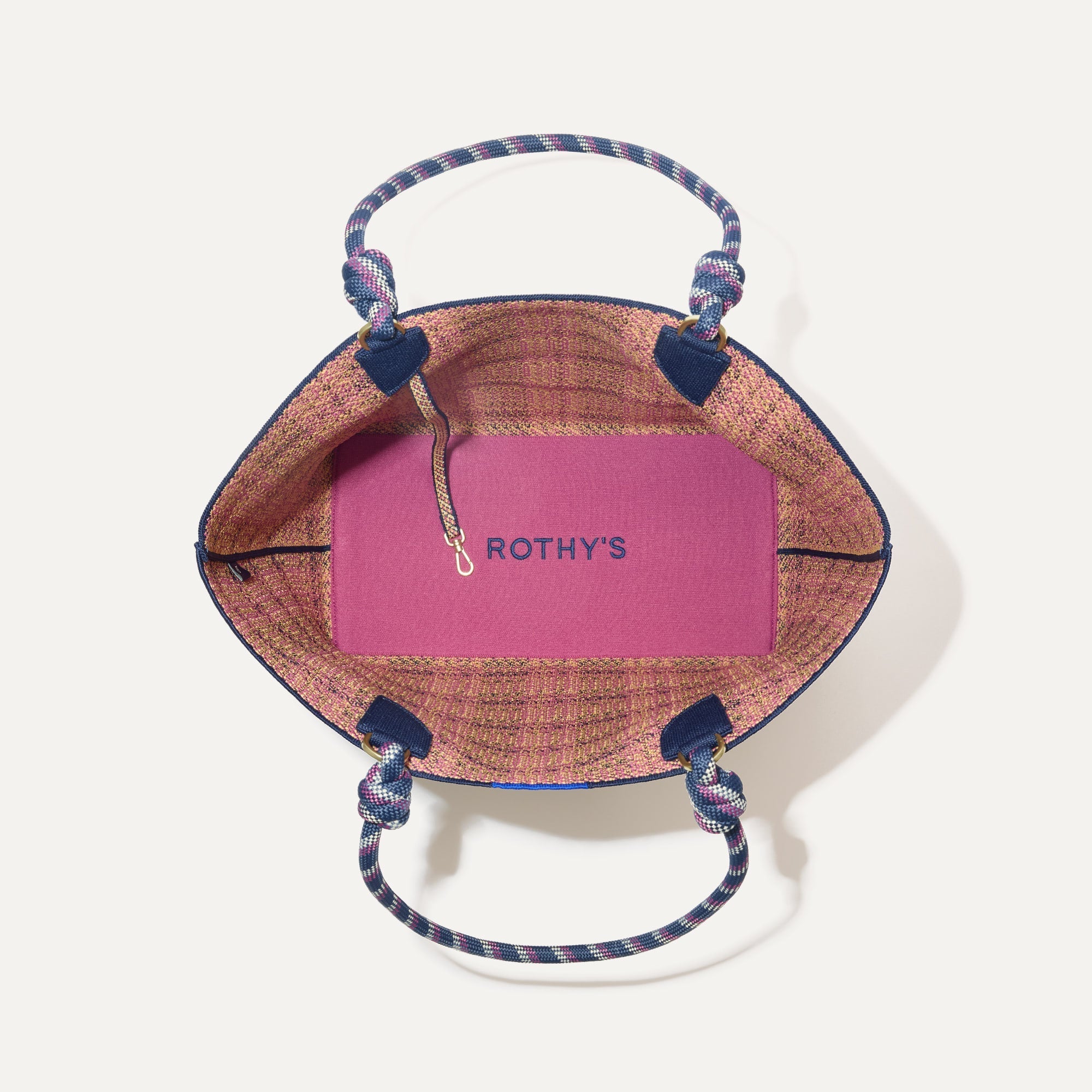 The Lightweight Tote in Spring Plaid shown open from the top, with interior visible. 