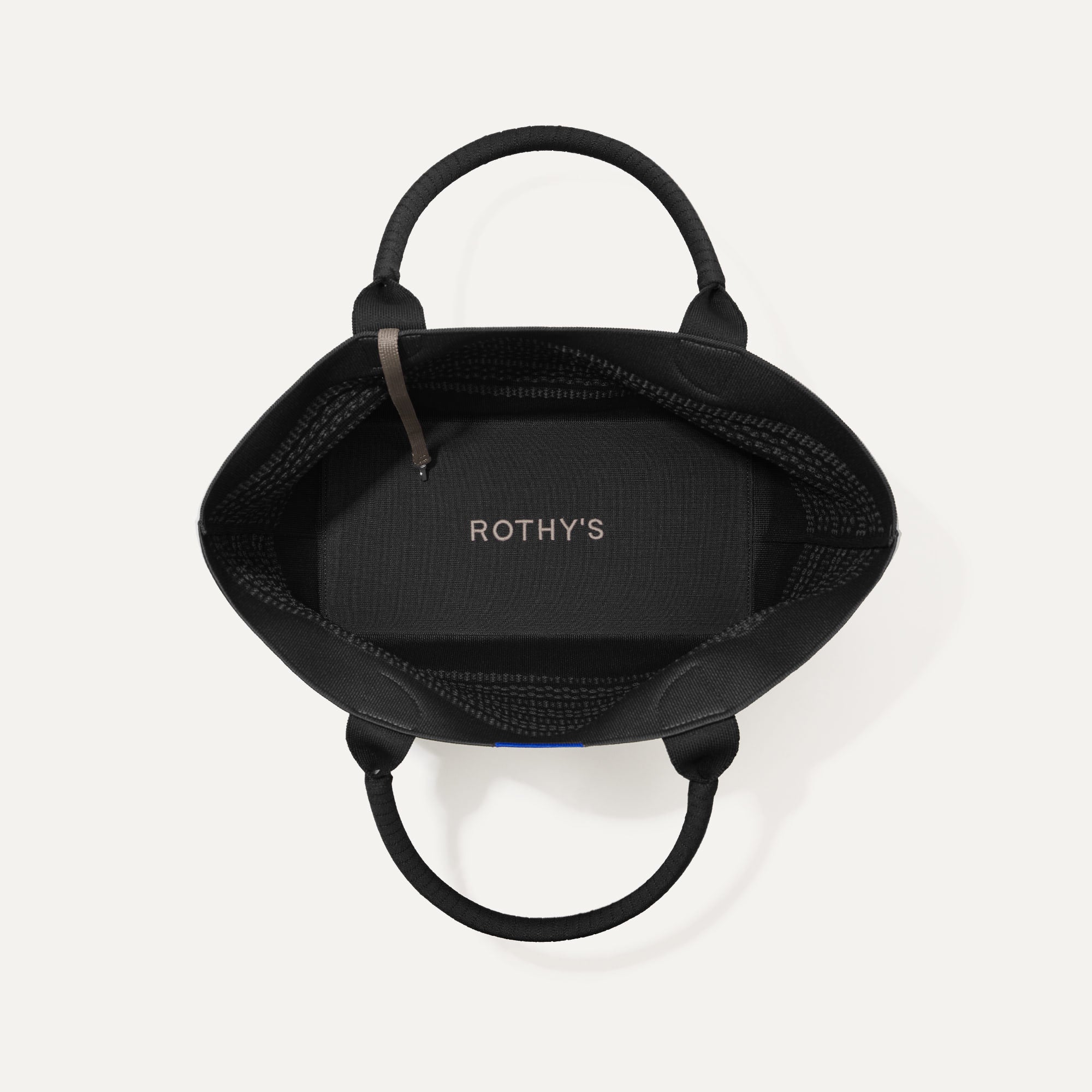 The Lightweight Tote in Black Crochet shown open from the top, with base insert visible. 