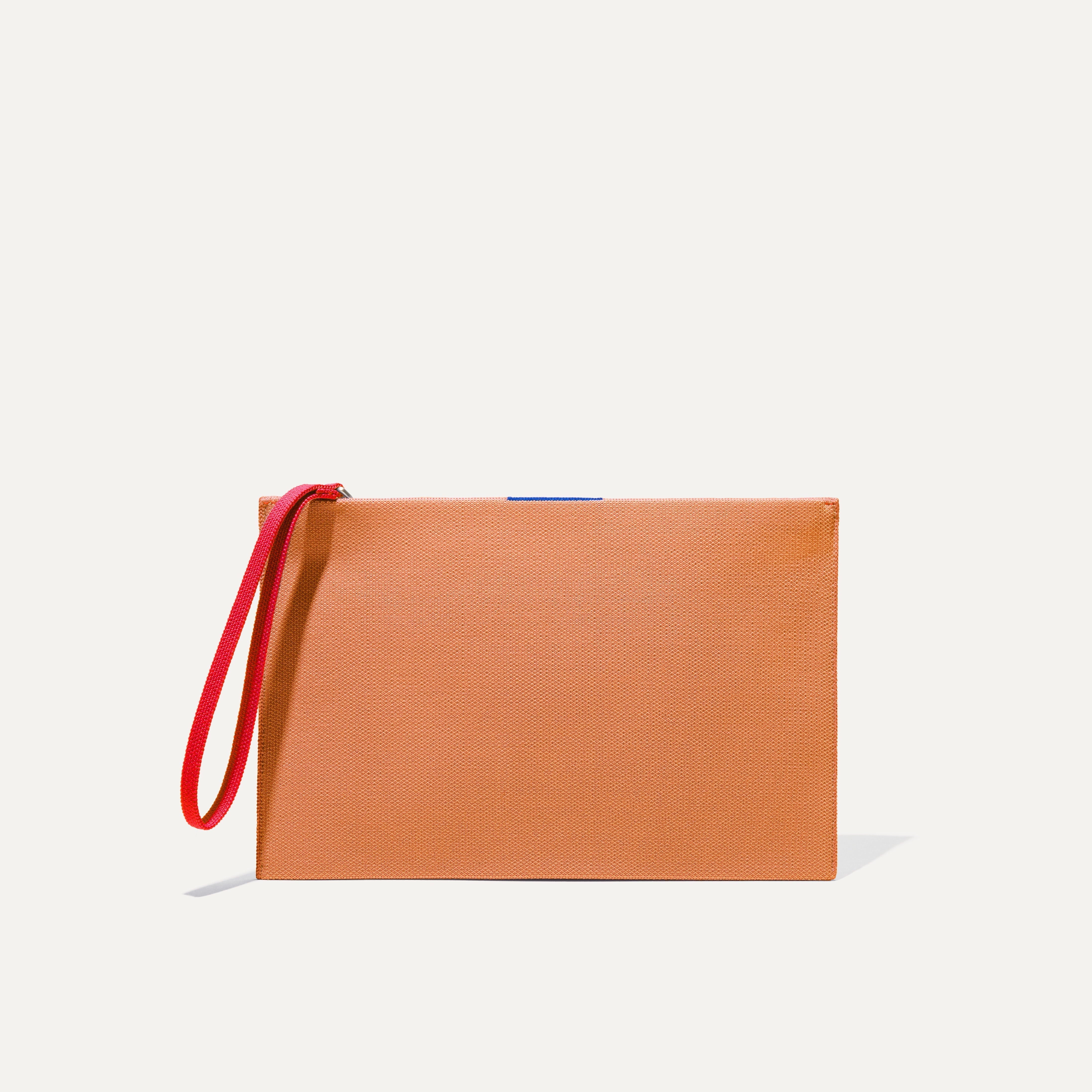 PLP |The Wristlet in Clementine shown from the front.