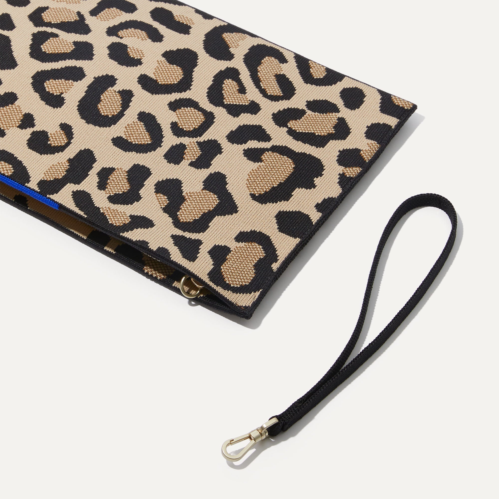 The Wristlet in Desert Cat shown with the wrist strap detached.