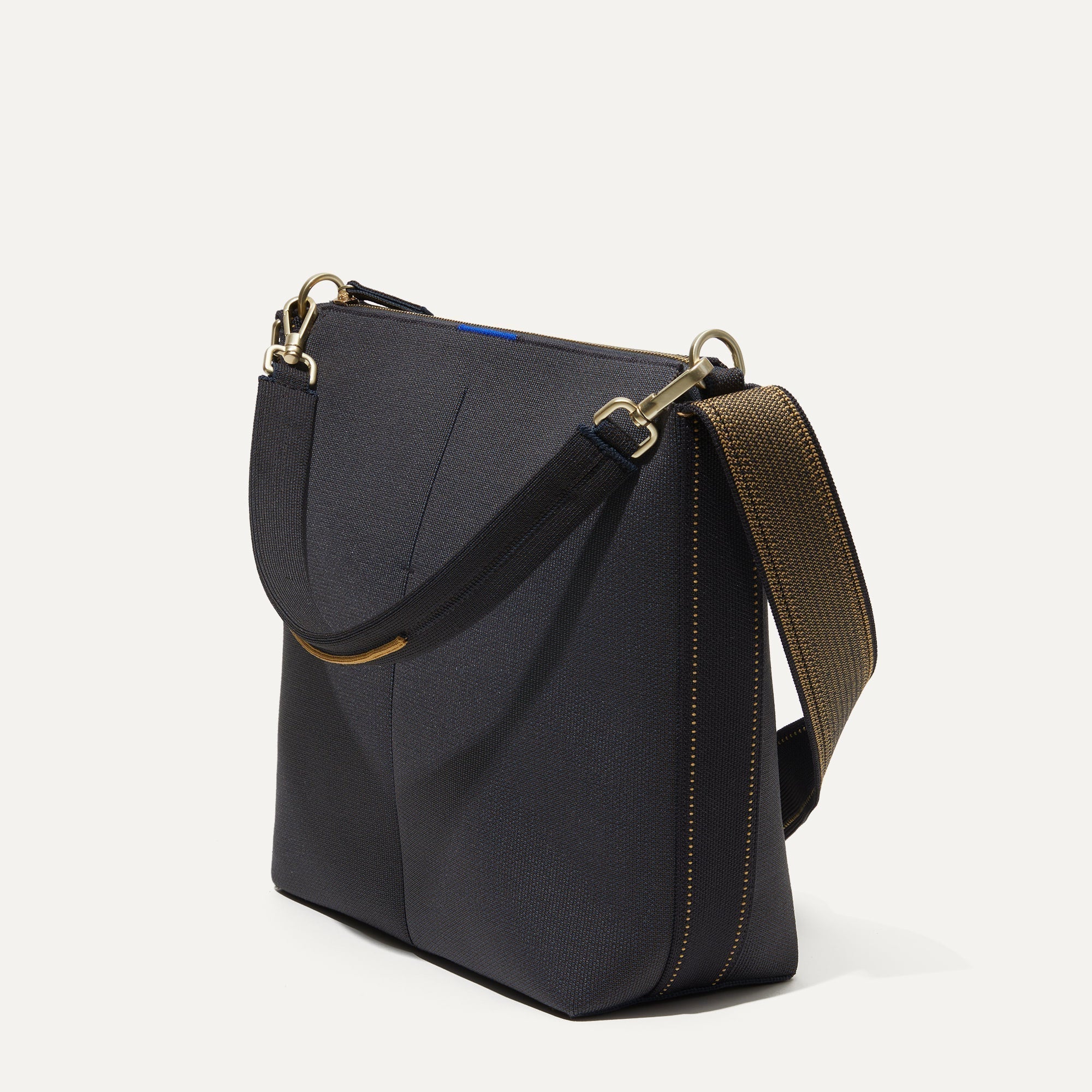 The Mini Zip Bucket in Ink and Ivory shown at a diagonal view from the left.