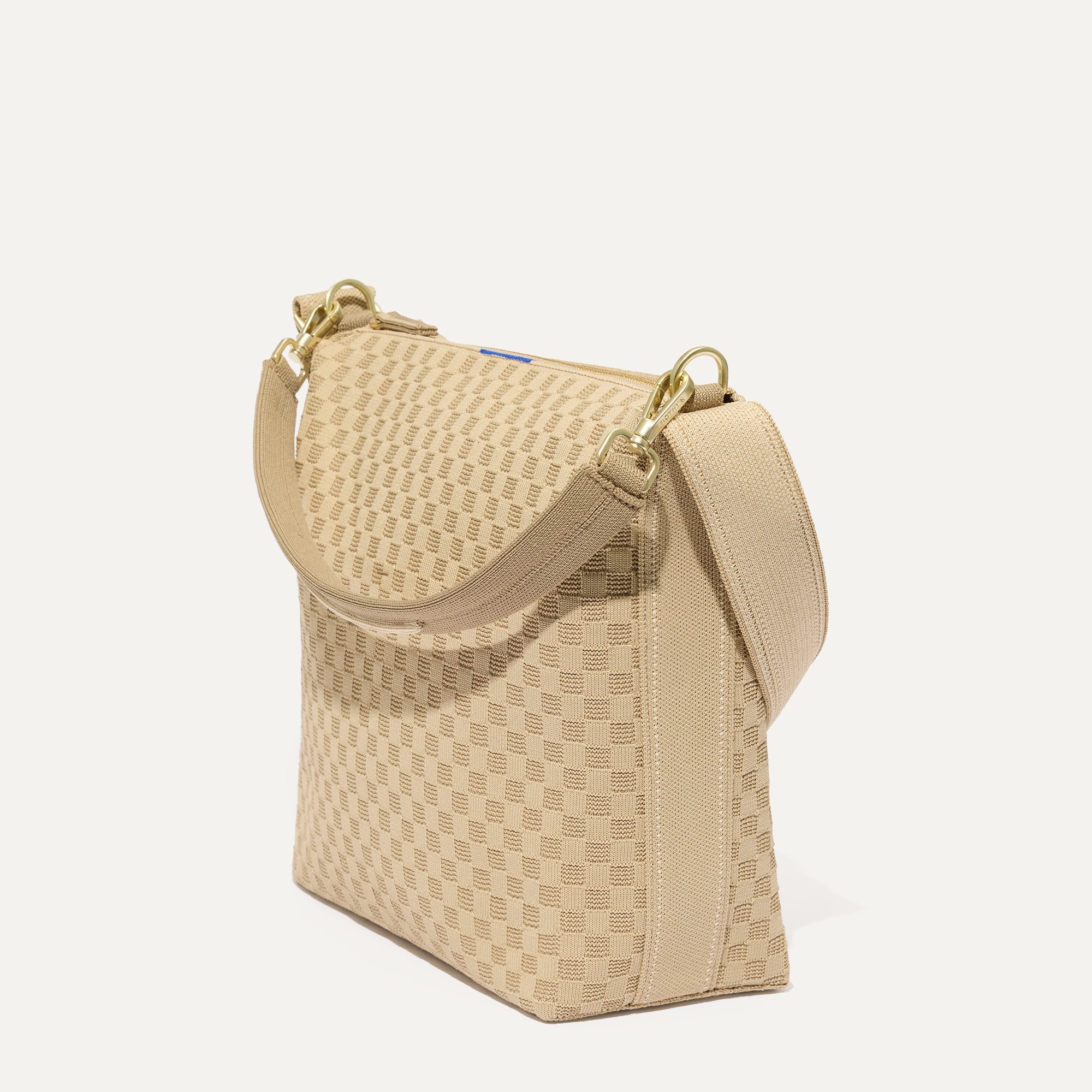 The Mini Zip Bucket in Knot Brown shown at a diagonal view from the left.