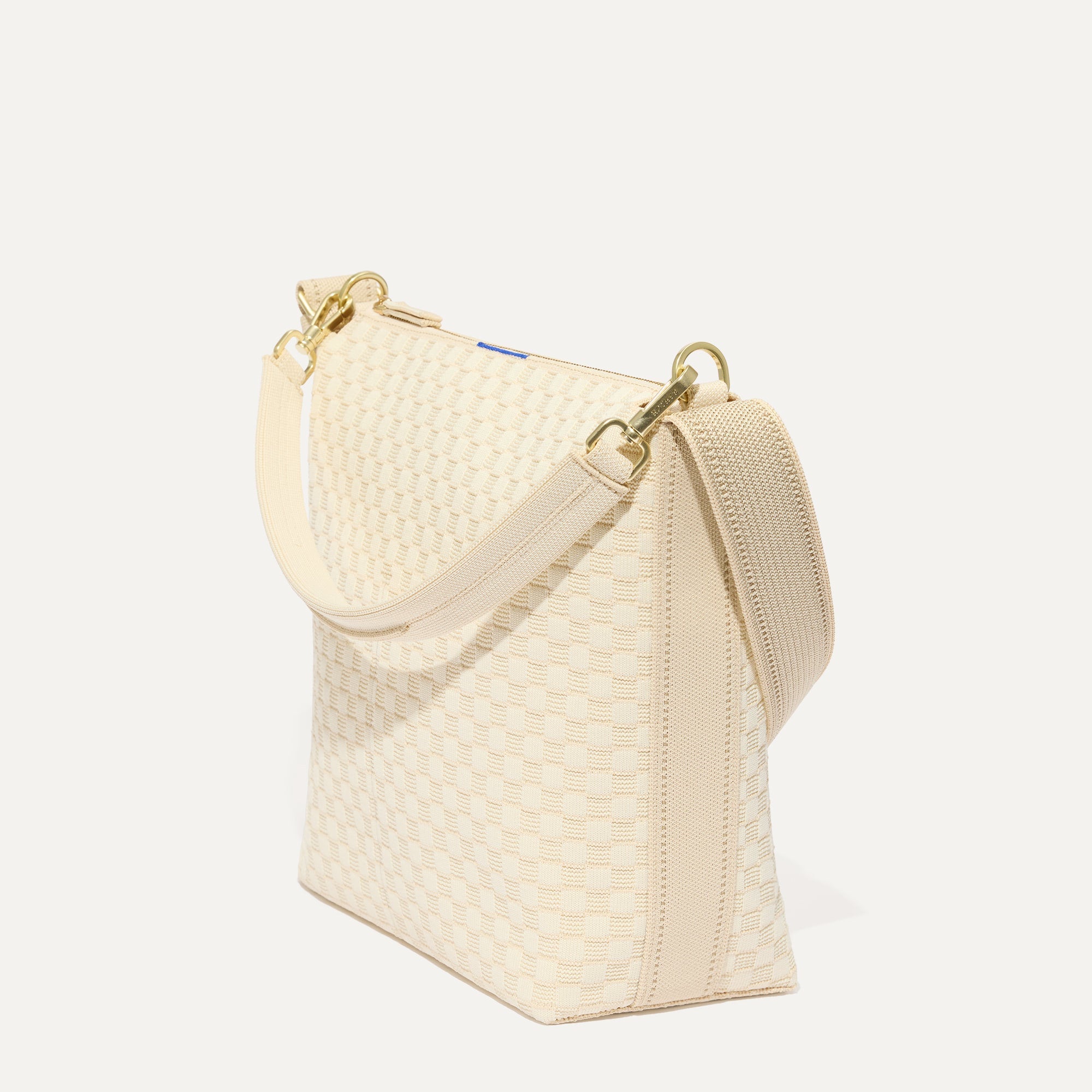 The Mini Zip Bucket in White Sand shown at a diagonal view from the left.