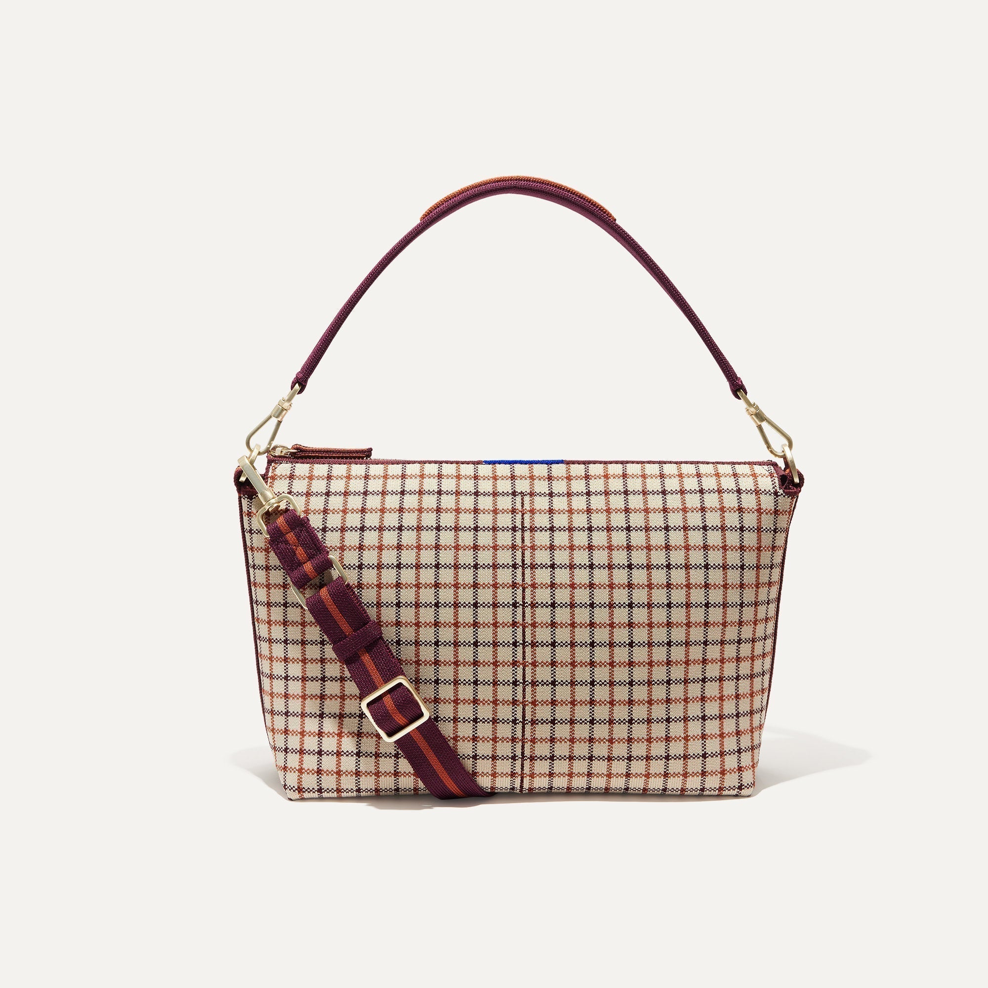 PLP |The Daily Crossbody Bag in Malbec Grid shown from the front.