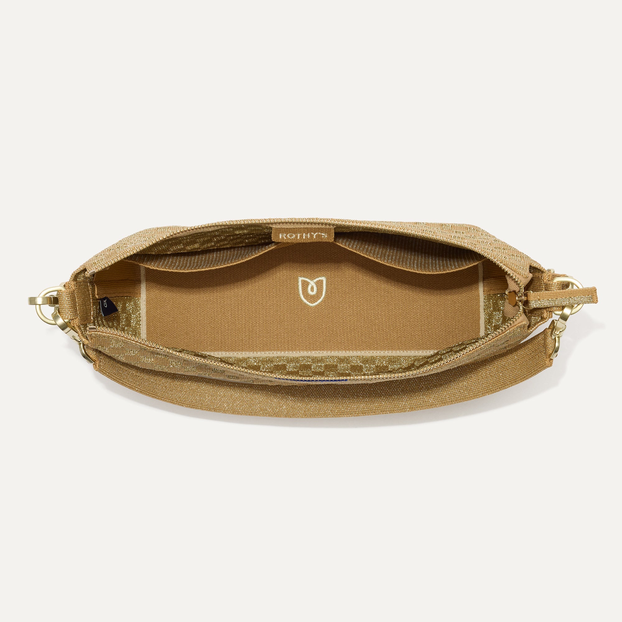 The Daily Crossbody in Golden Sun,  shown from the top down, with zipper open and interior exposed.