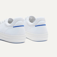 Close up of the heel of The RS02 Sneaker in Bright White, with the padded ankle collar and Rothy's signature blue halo.
