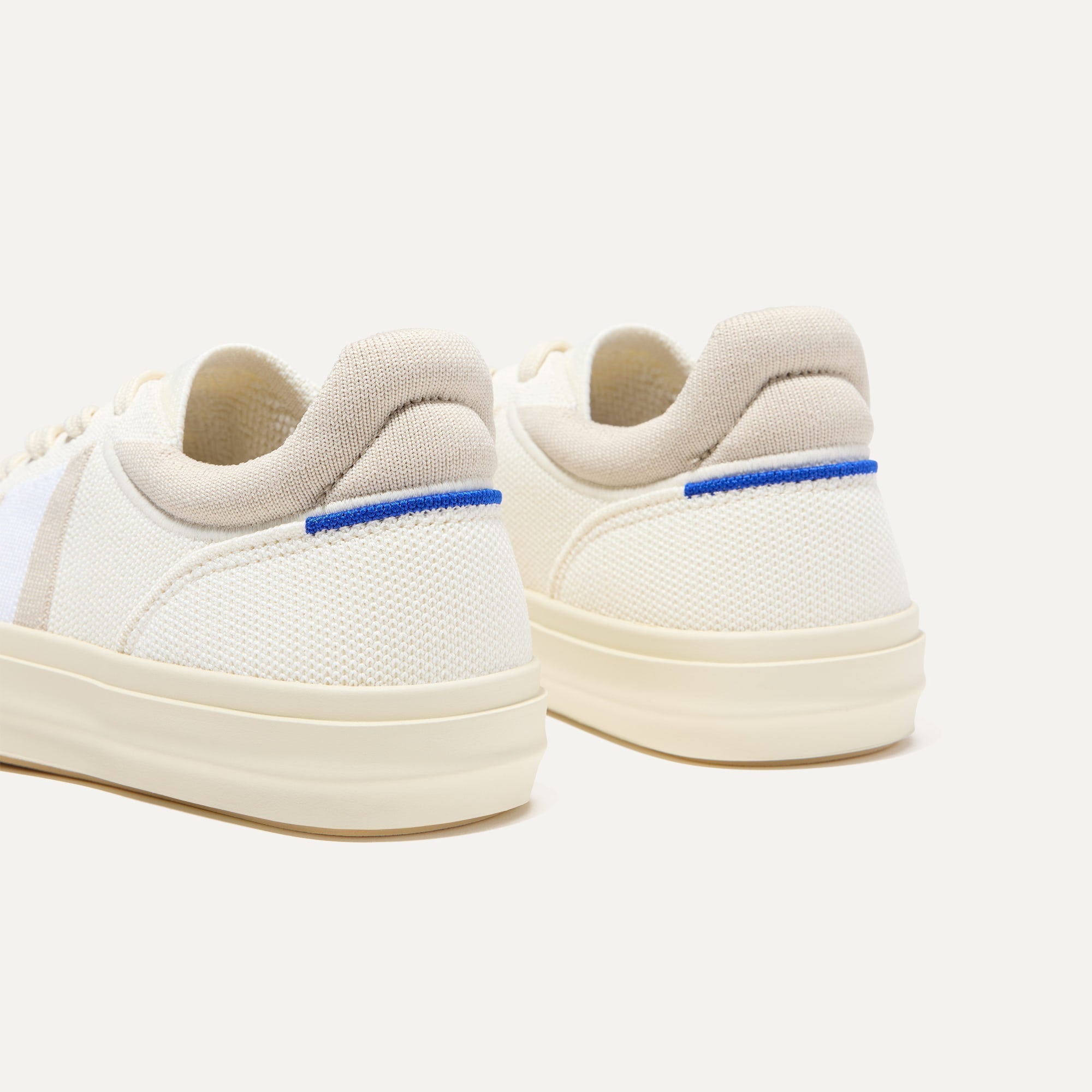 Close up of the heel of The RS02 Sneaker in Buff, with the padded ankle collar and Rothy's signature blue halo.