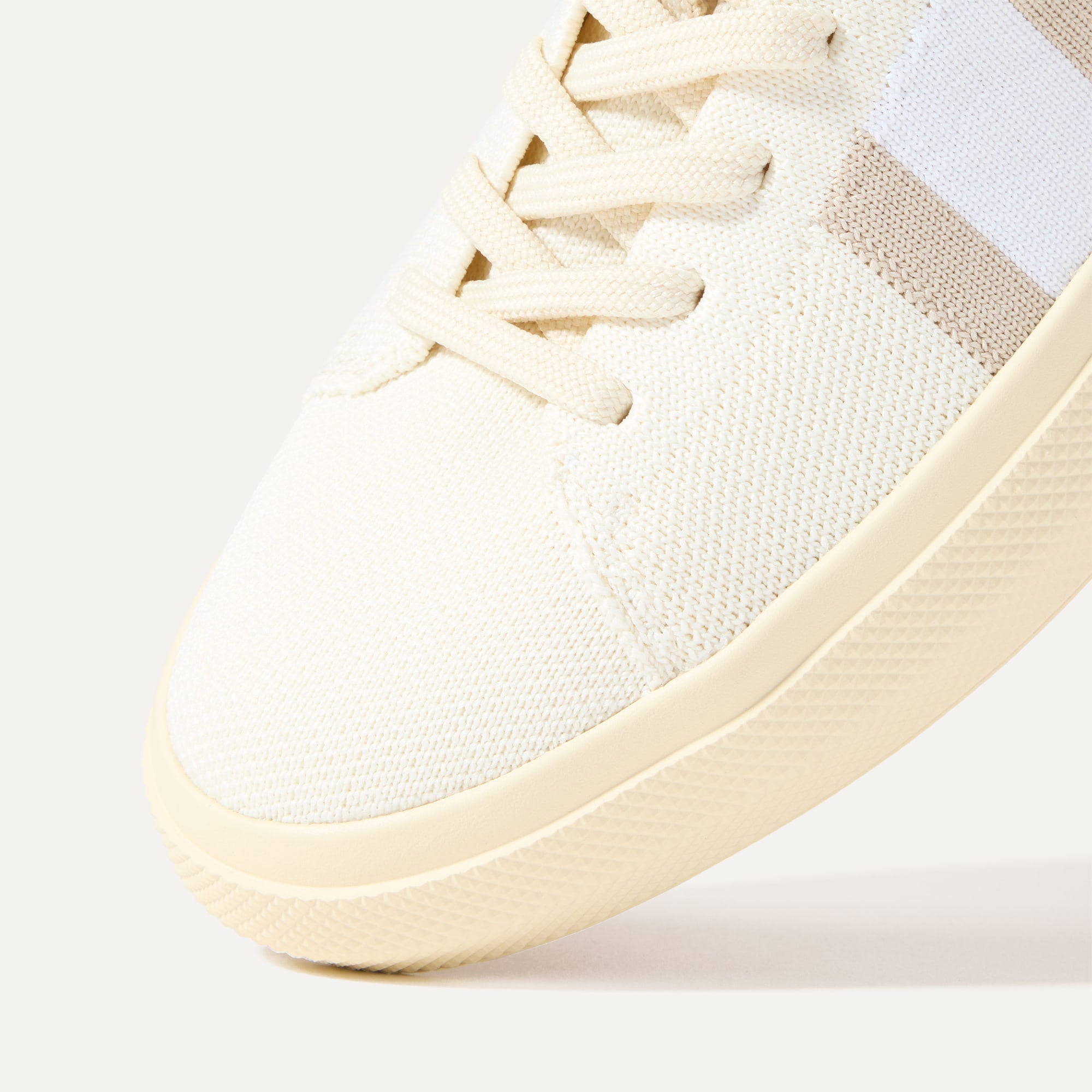 Close up of the toe and stitching details of The RS02 Sneaker in Buff.
