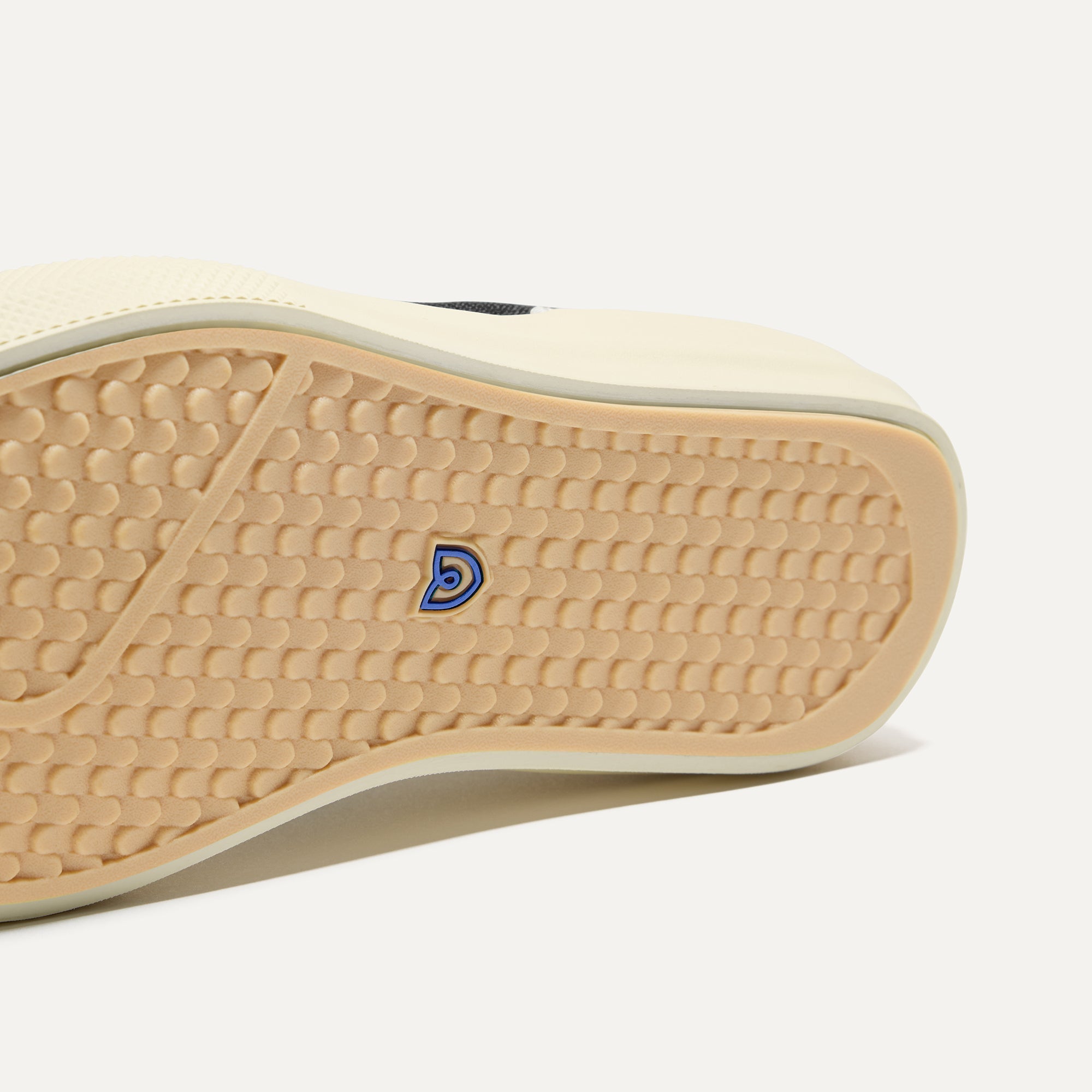 Close up of the outsoles of The RS02 Sneaker in Jet, with raised grooves for added traction.