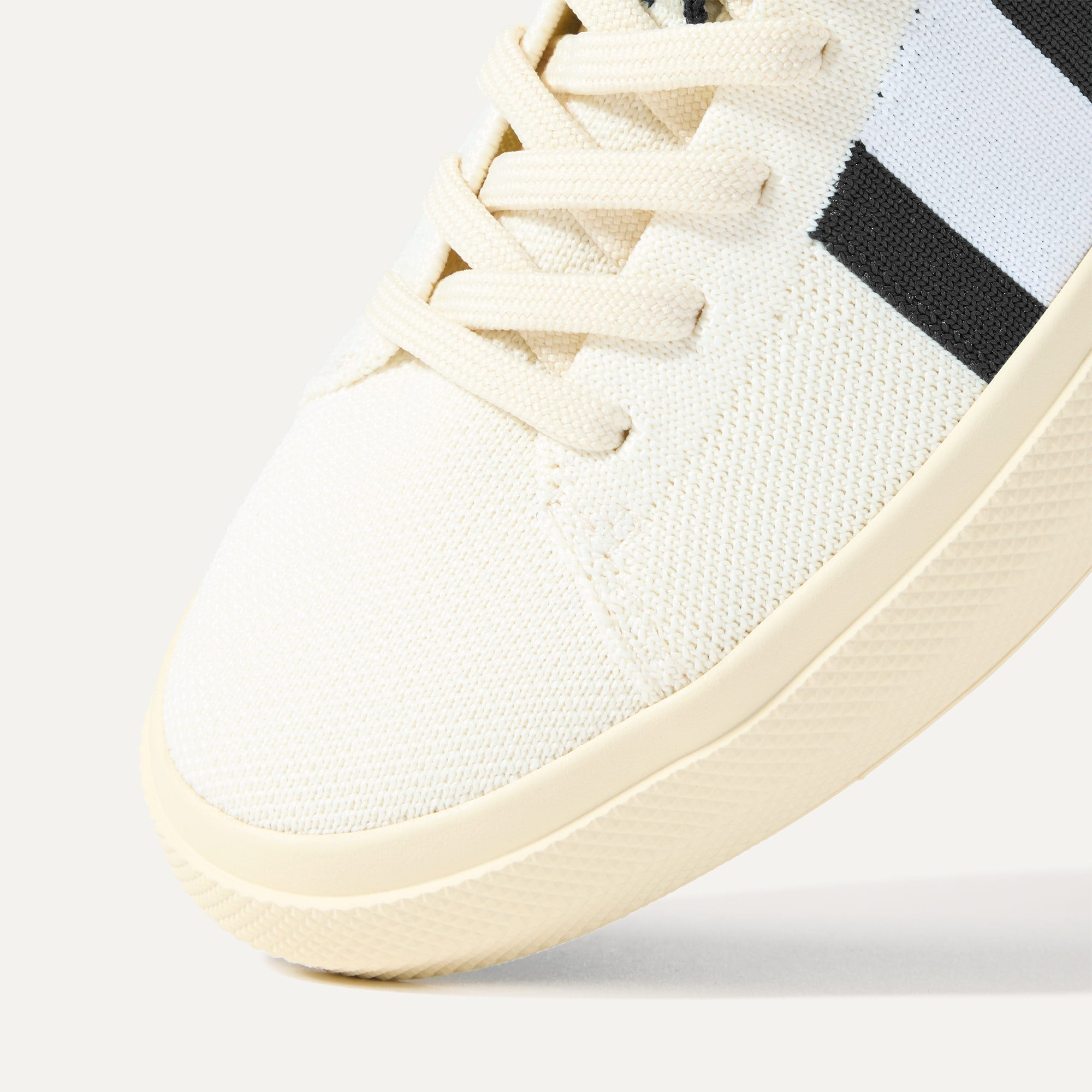 Close up of the toe and stitching details of The RS02 Sneaker in Jet.