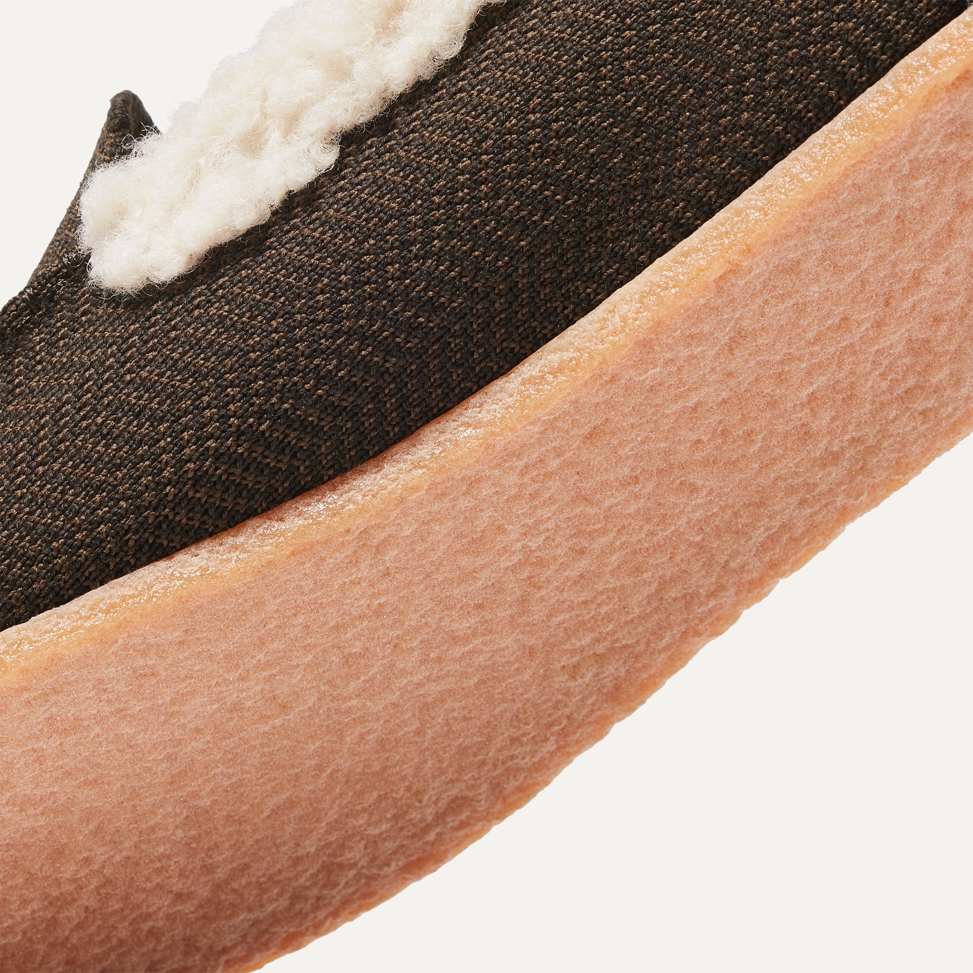 Close up of the outsoles of The Men's Slipper in Mahogany Herringbone.