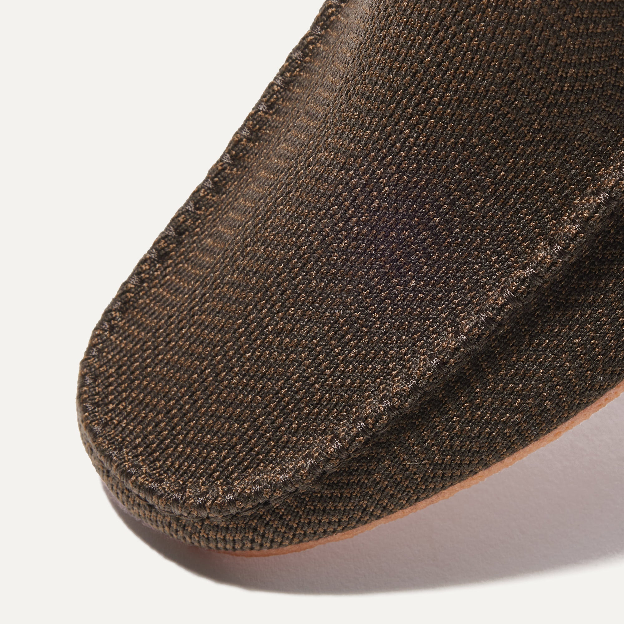 The toe and vamp of The Men's Slipper, in diagonal view.