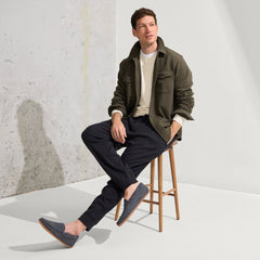 Alternate view of a model wearing The Men's Slipper in Charcoal Herringbone.
