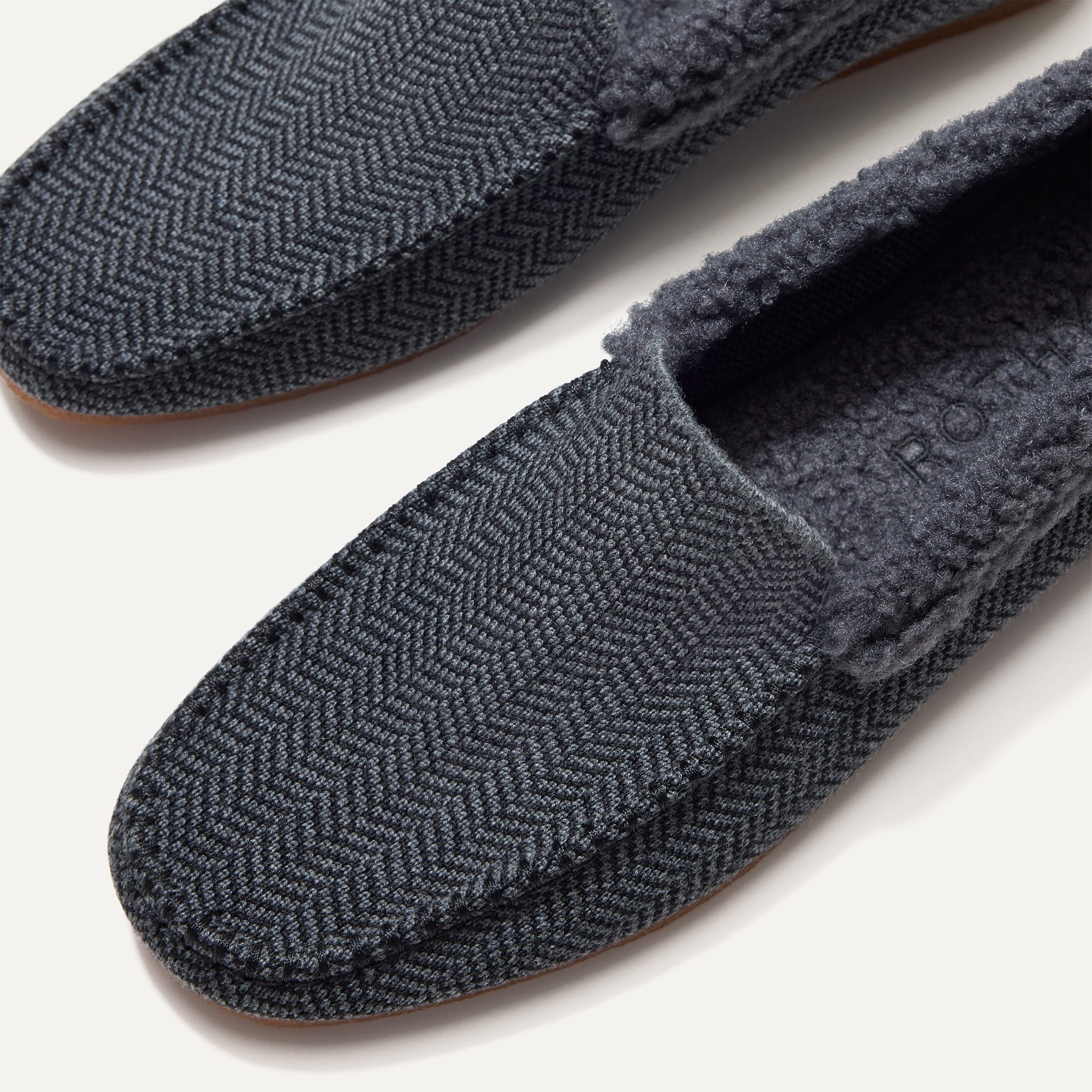 The toe and vamp of The Men's Slipper, in diagonal view.