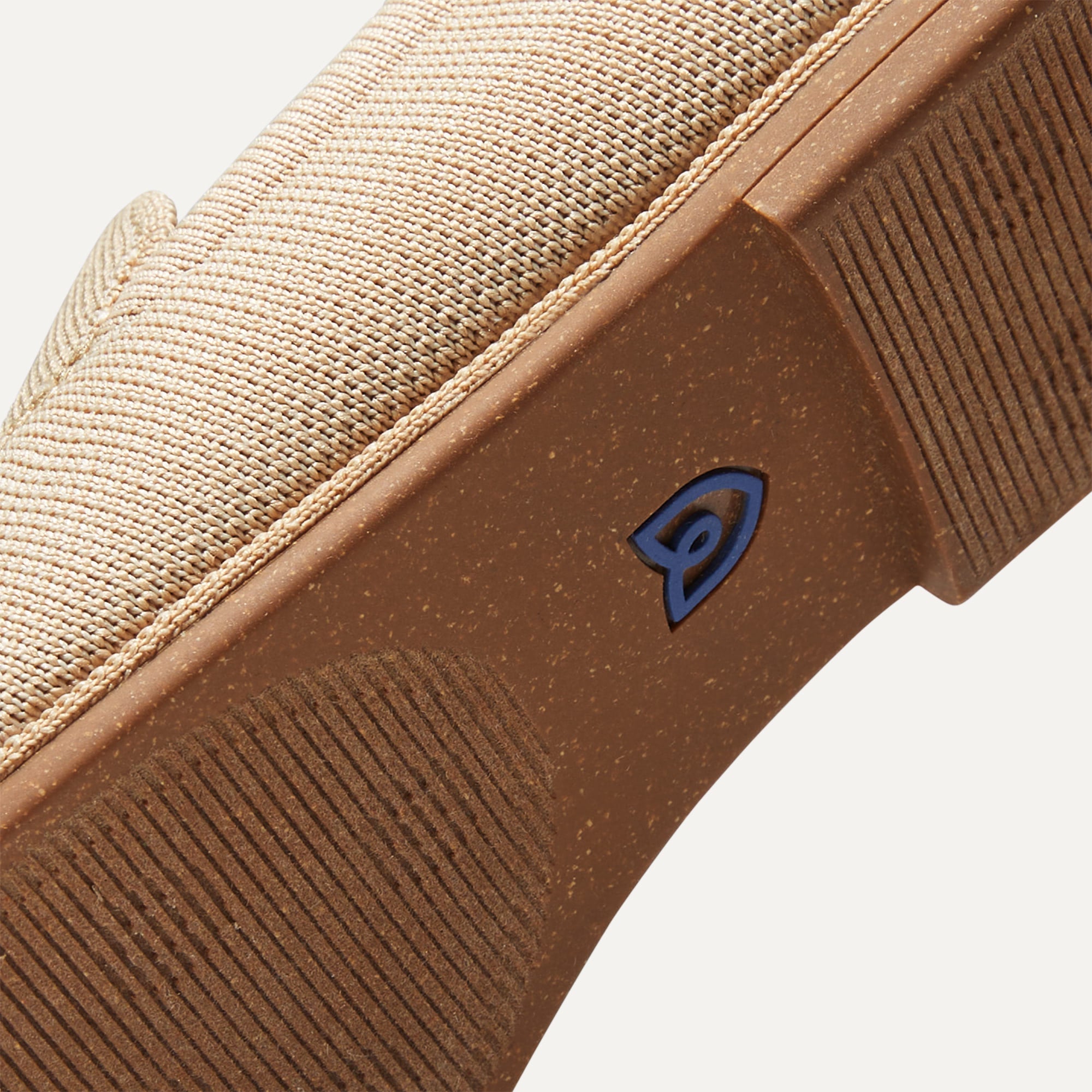 Outsole of The Ravello Loafer in Sand shown from below, in diagonal view.