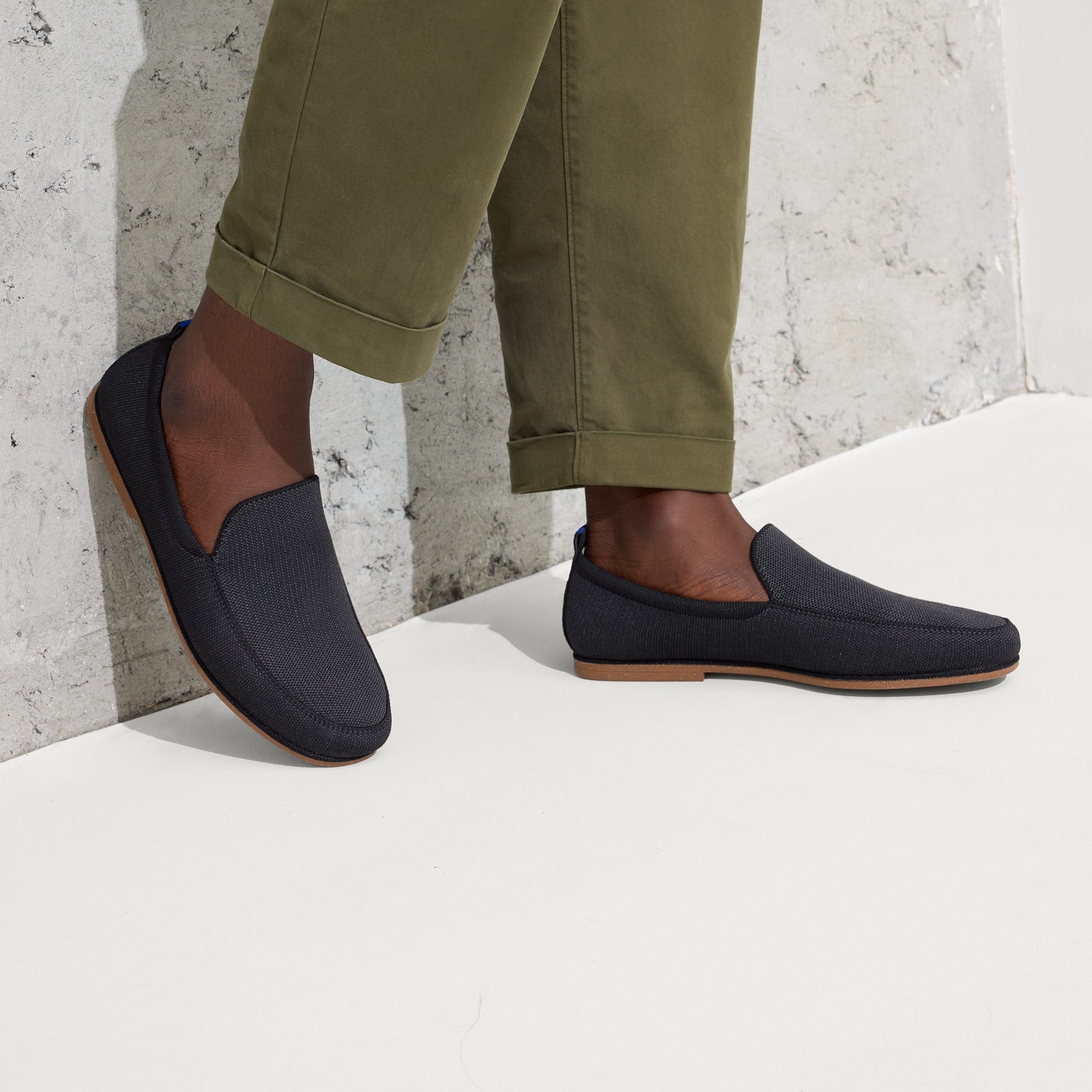 hover | Model wearing The Ravello Loafer in Stone Black.