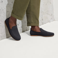 hover | Model wearing The Ravello Loafer in Stone Black.