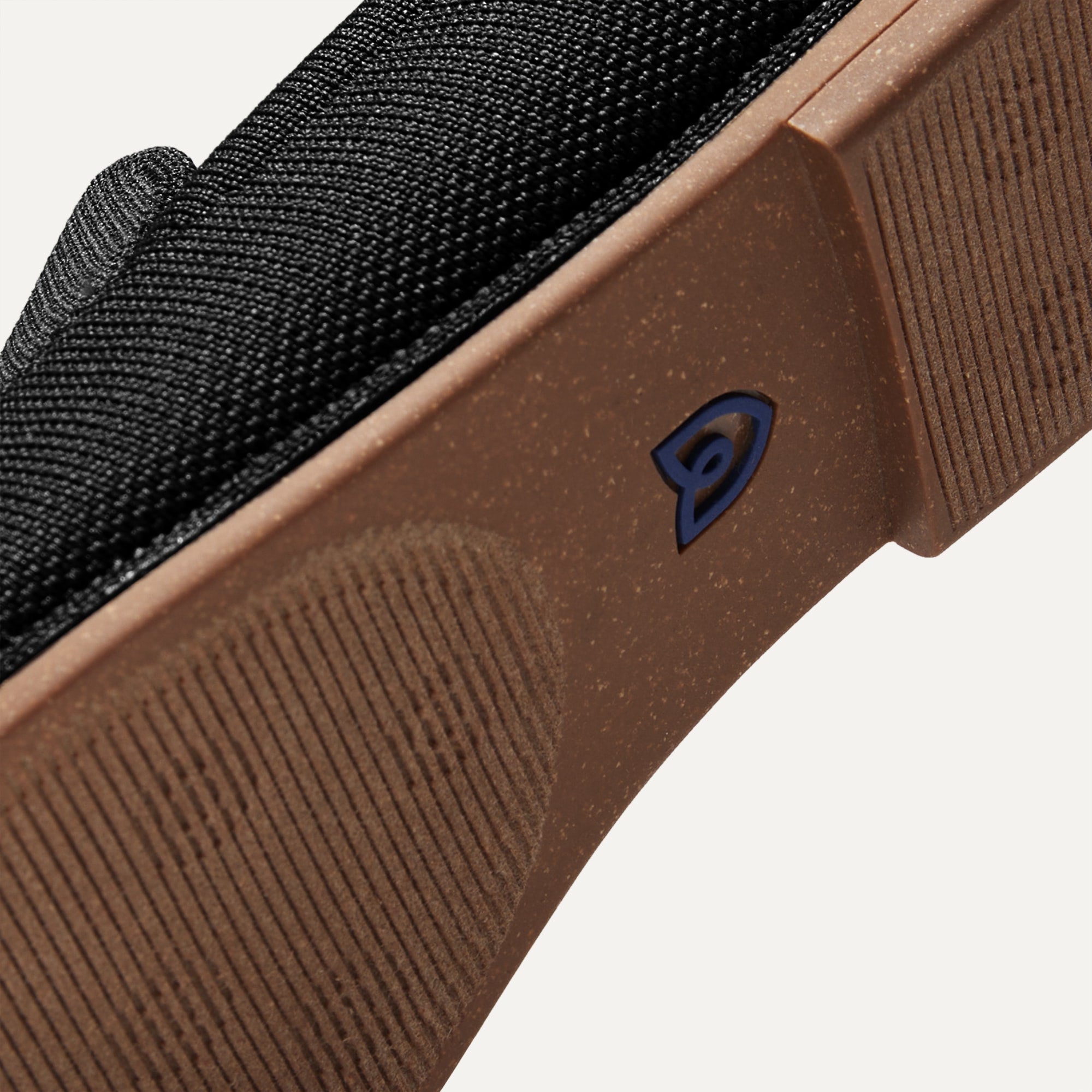 Outsole of The Ravello Loafer in Stone Black shown from below, in diagonal view.