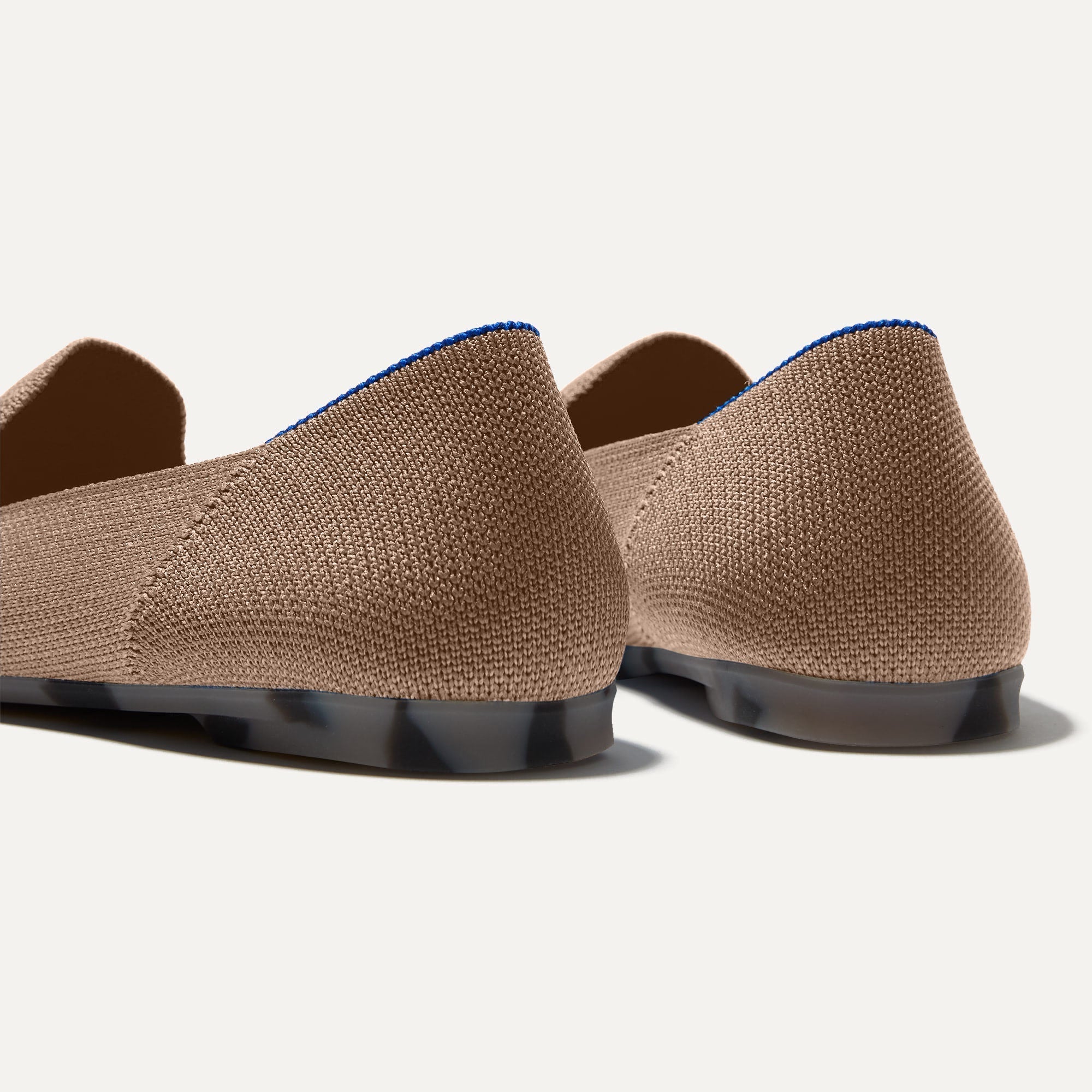 Close up of the heel of The Almond Loafer in Portobello, with Rothy's signature blue halo. 