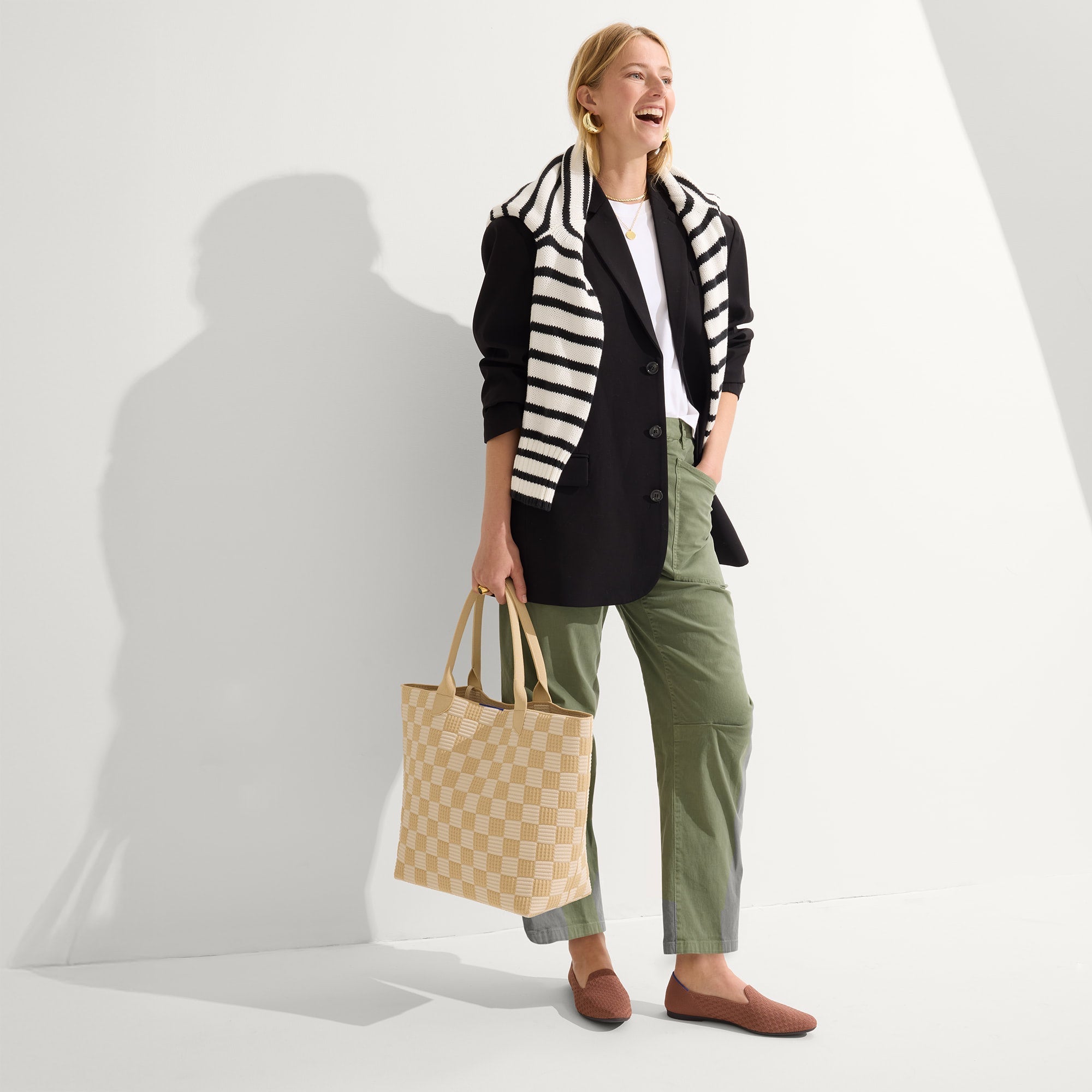 hover | Model holding The Lightweight Tote in Checker Sand.