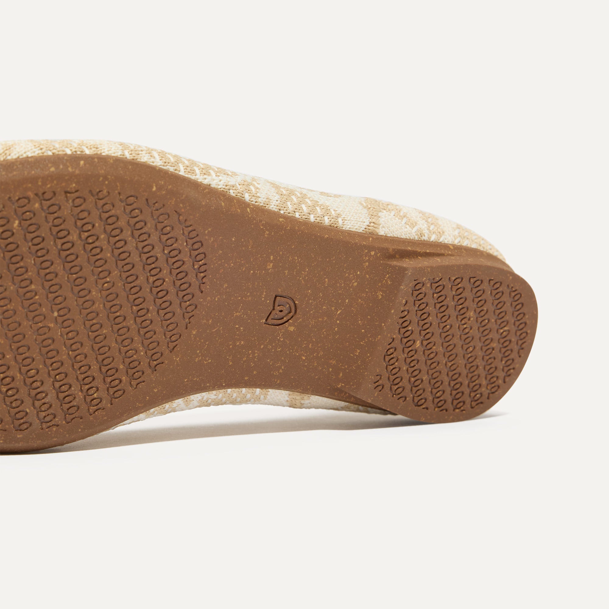 The sole of The Almond Loafer in Pearl Bouquet shown in diagonal view.