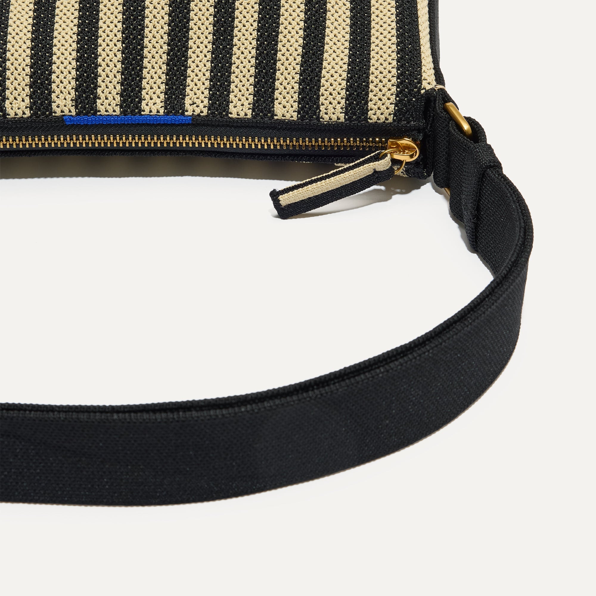A closeup of The Casual Crossbody in Black Tie, focusing on the crossbody strap. 