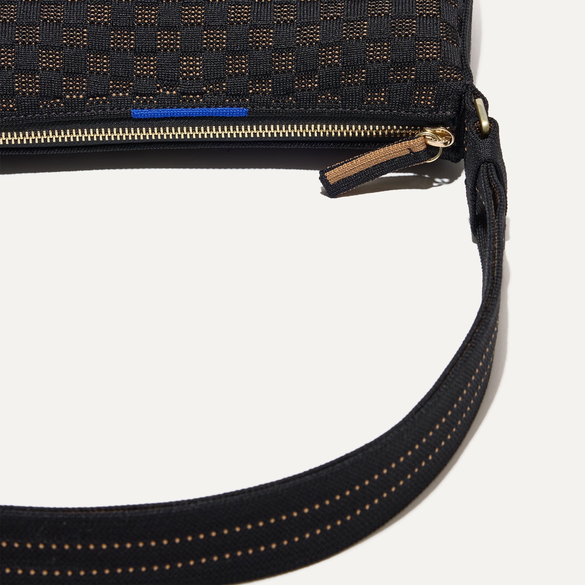 A closeup of The Casual Crossbody in Night Song, focusing on the crossbody strap. 