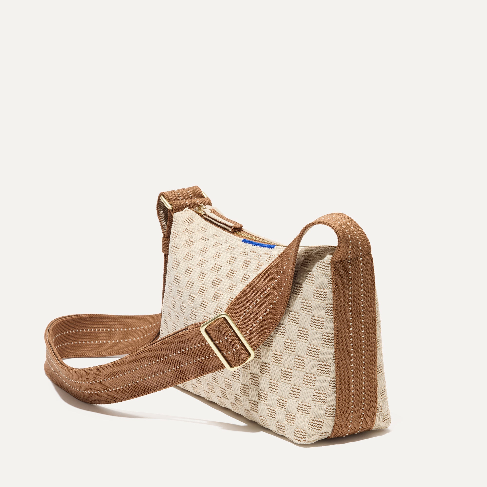 The Casual Crossbody in Vanilla Wafer, shown from the side at an angle.