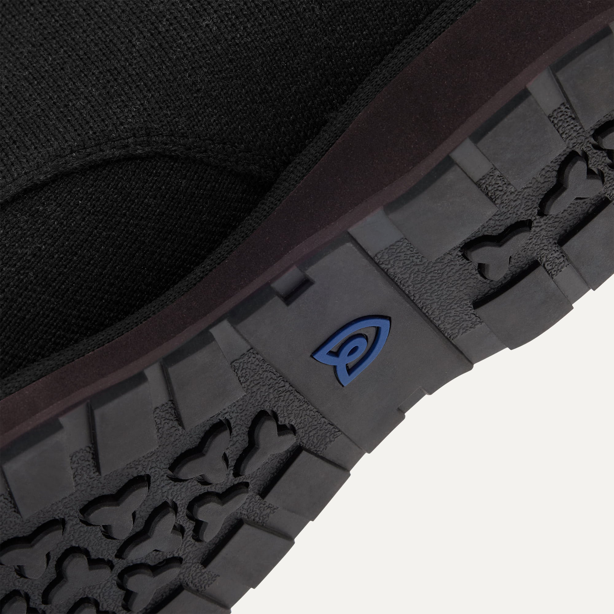 Close up of the outsoles of The Chukka Boot in Black, with raised grooves for added traction. 